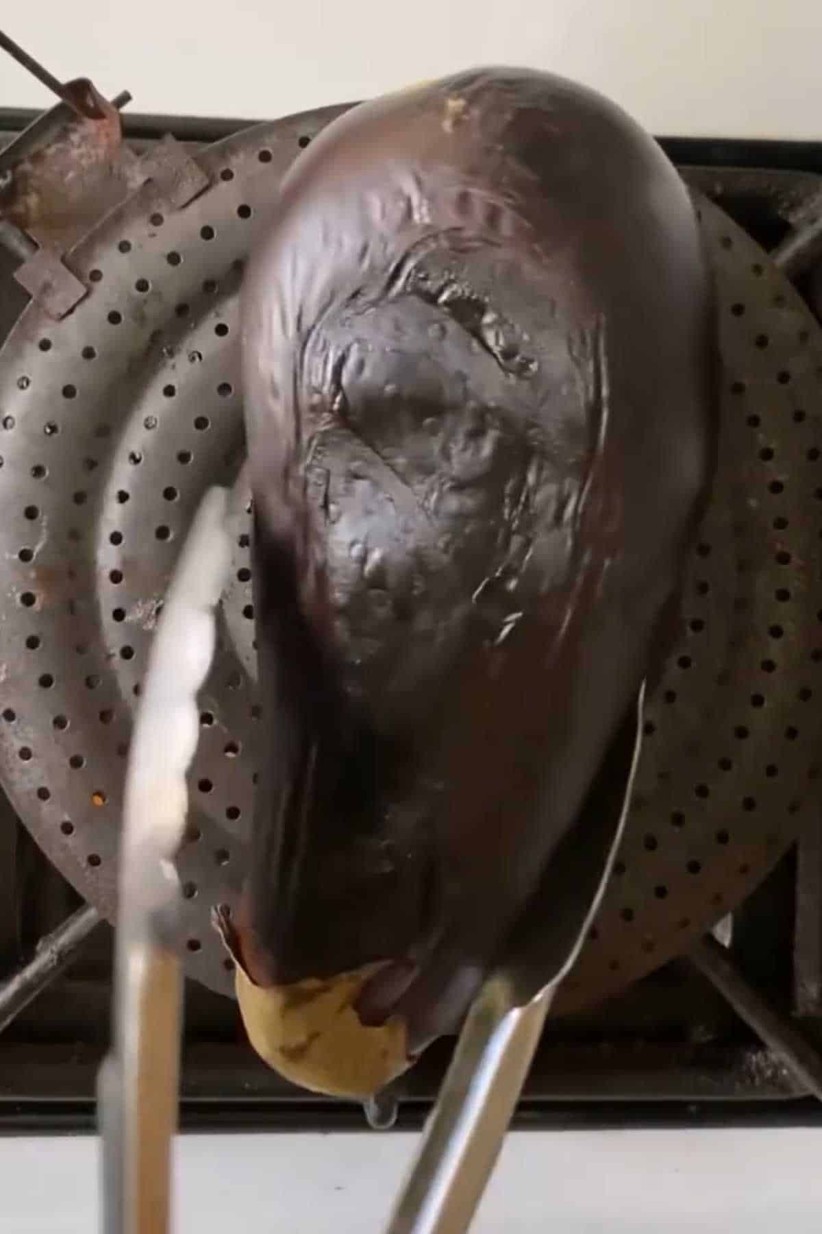 Roasting eggplant on a metal rack. 