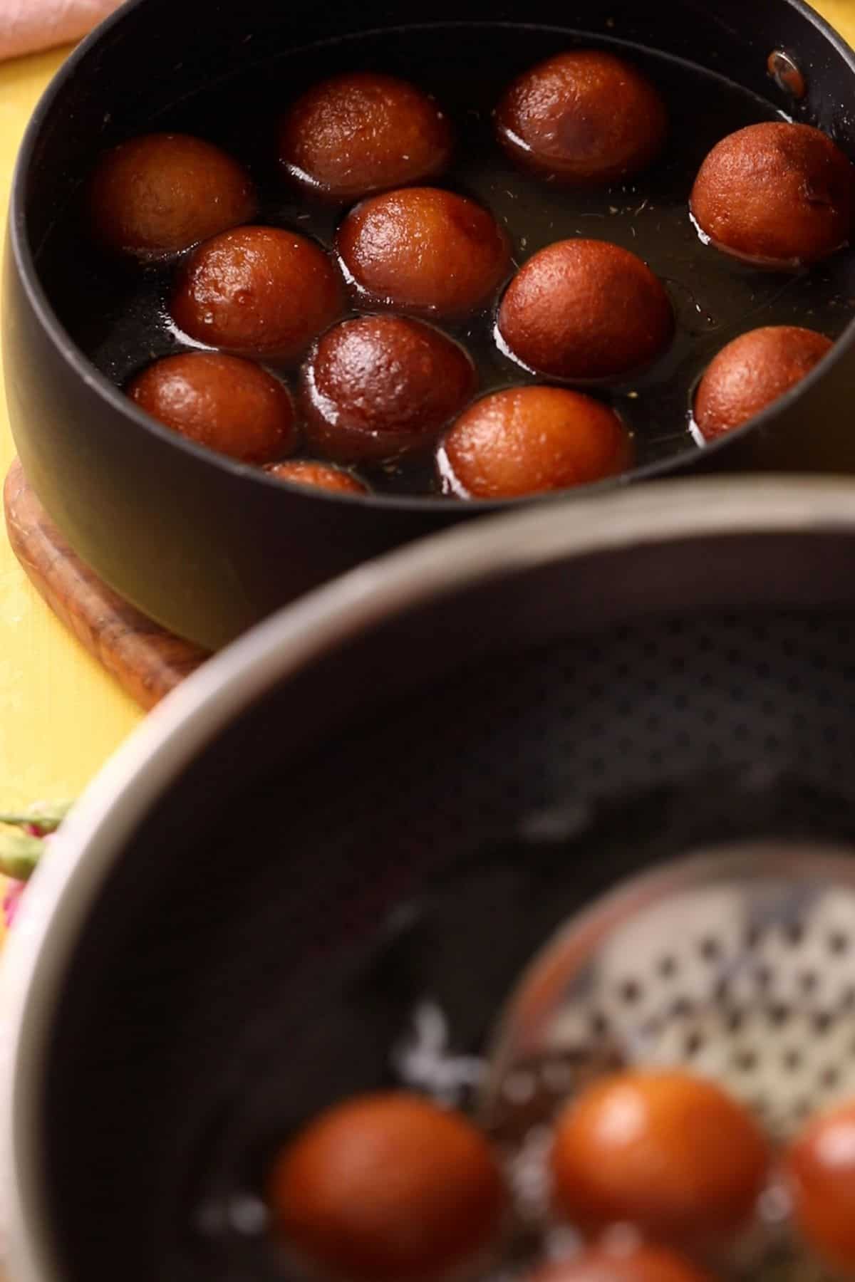 Gulab jamun are added to hot sugar syrup.