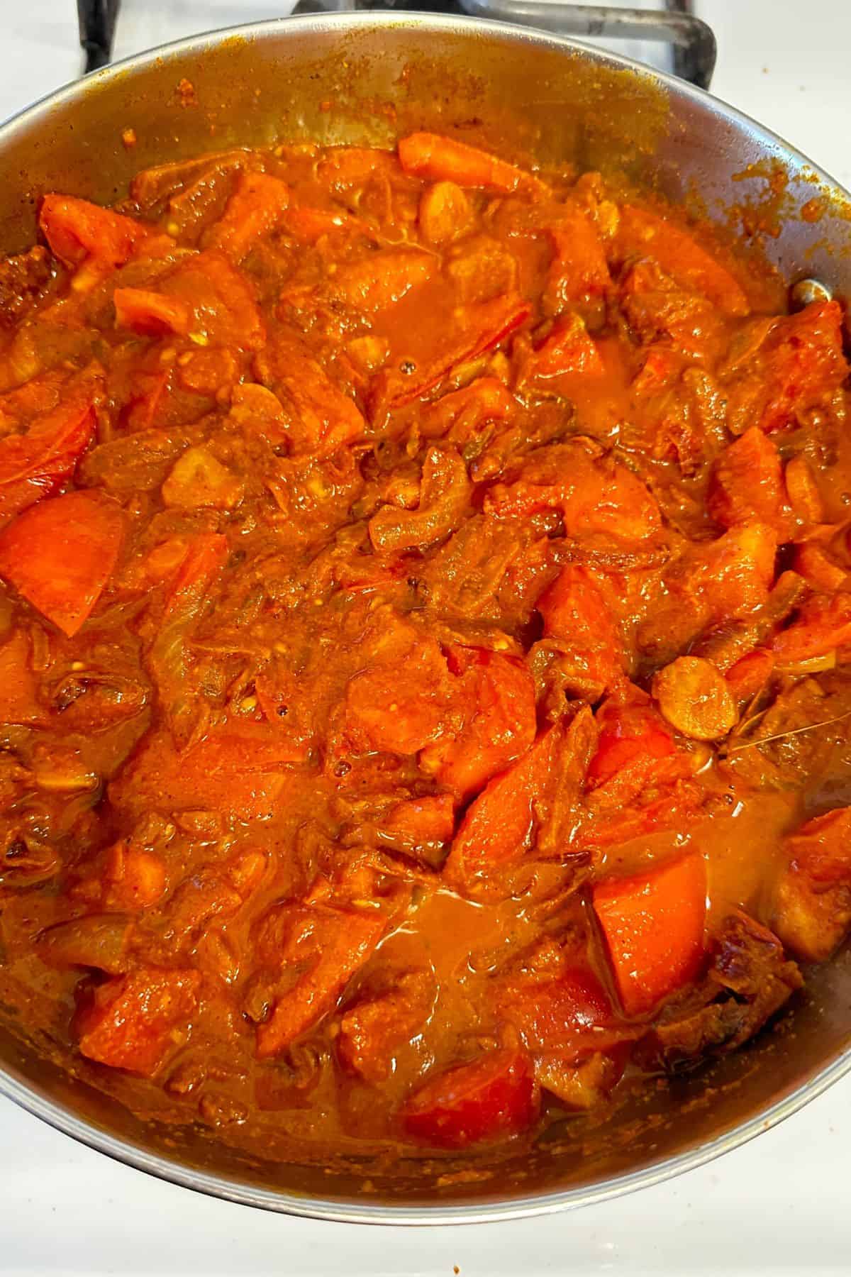 Tomatoes are cooked until they start softening.