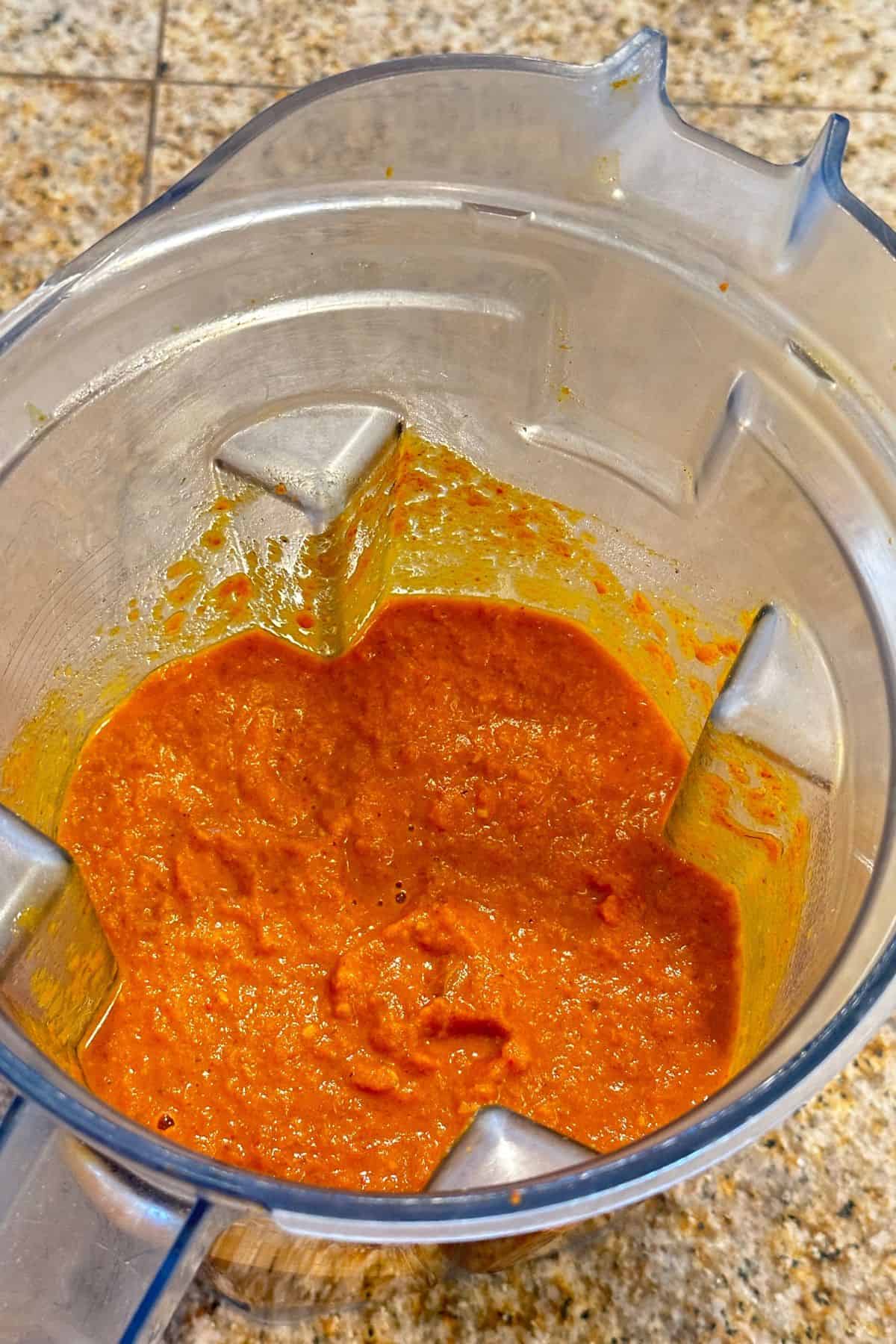 Indian curry sauce is coarsely ground in a high speed blender.