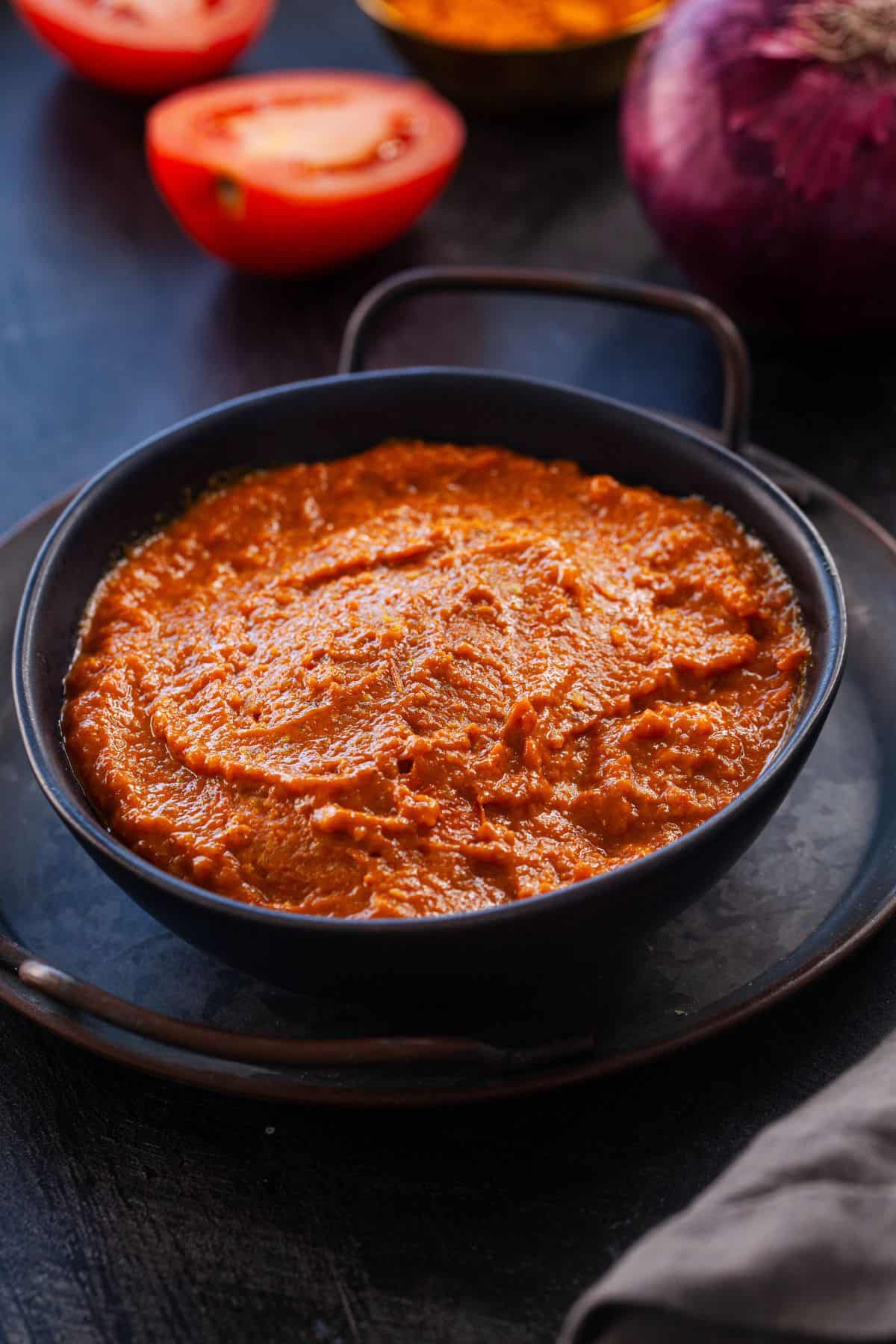 Indian Curry Sauce placed in a black bowl.