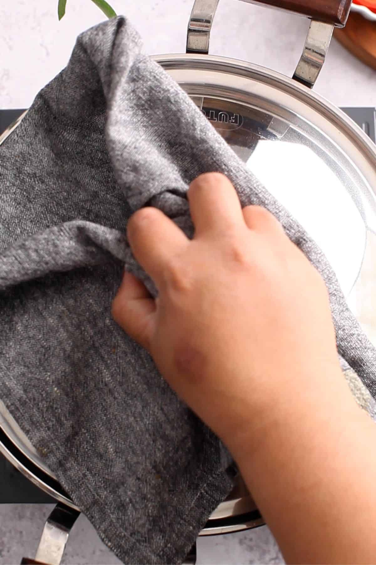 Tehri is covered and let to cook. 