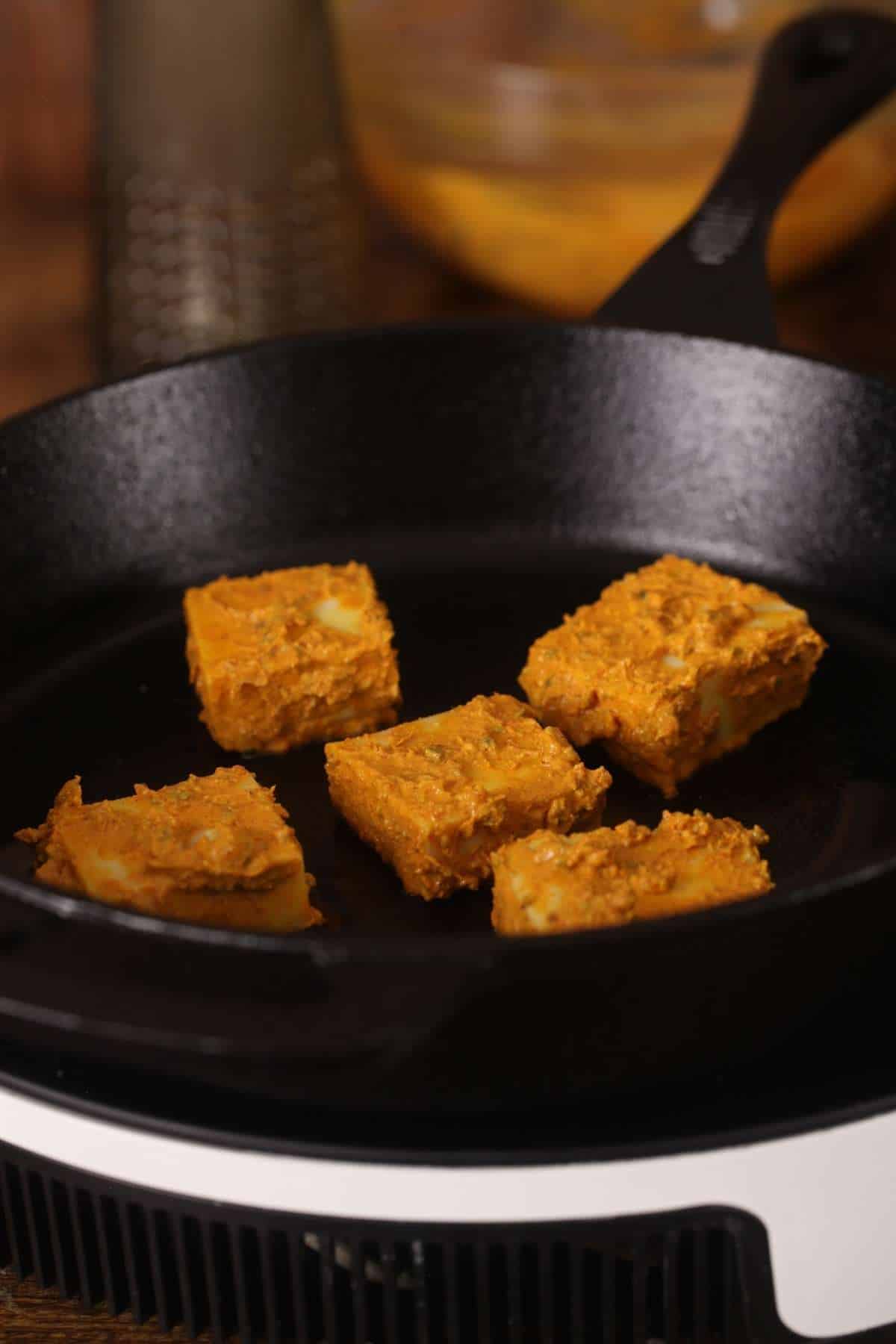 Tikka being cooked on tawa