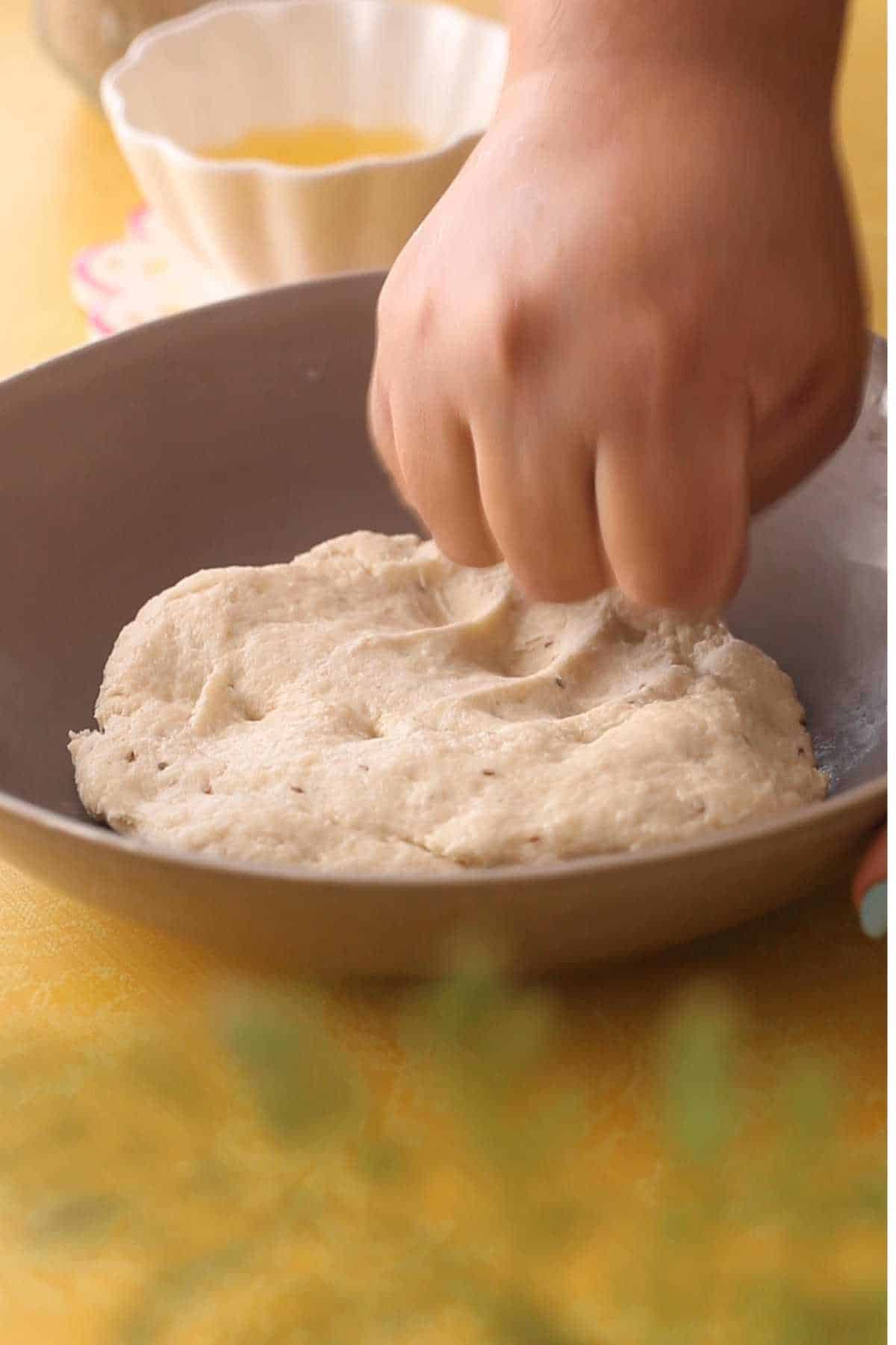 Kneading papri dough with knuckles.