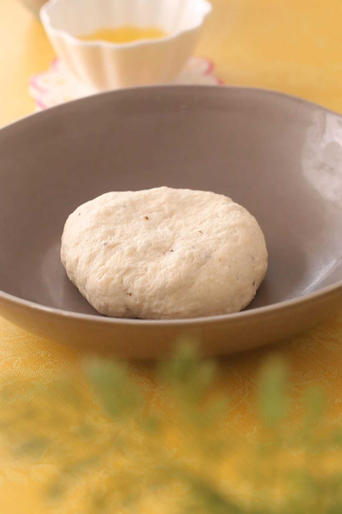 Papdi dough in a brown bowl.