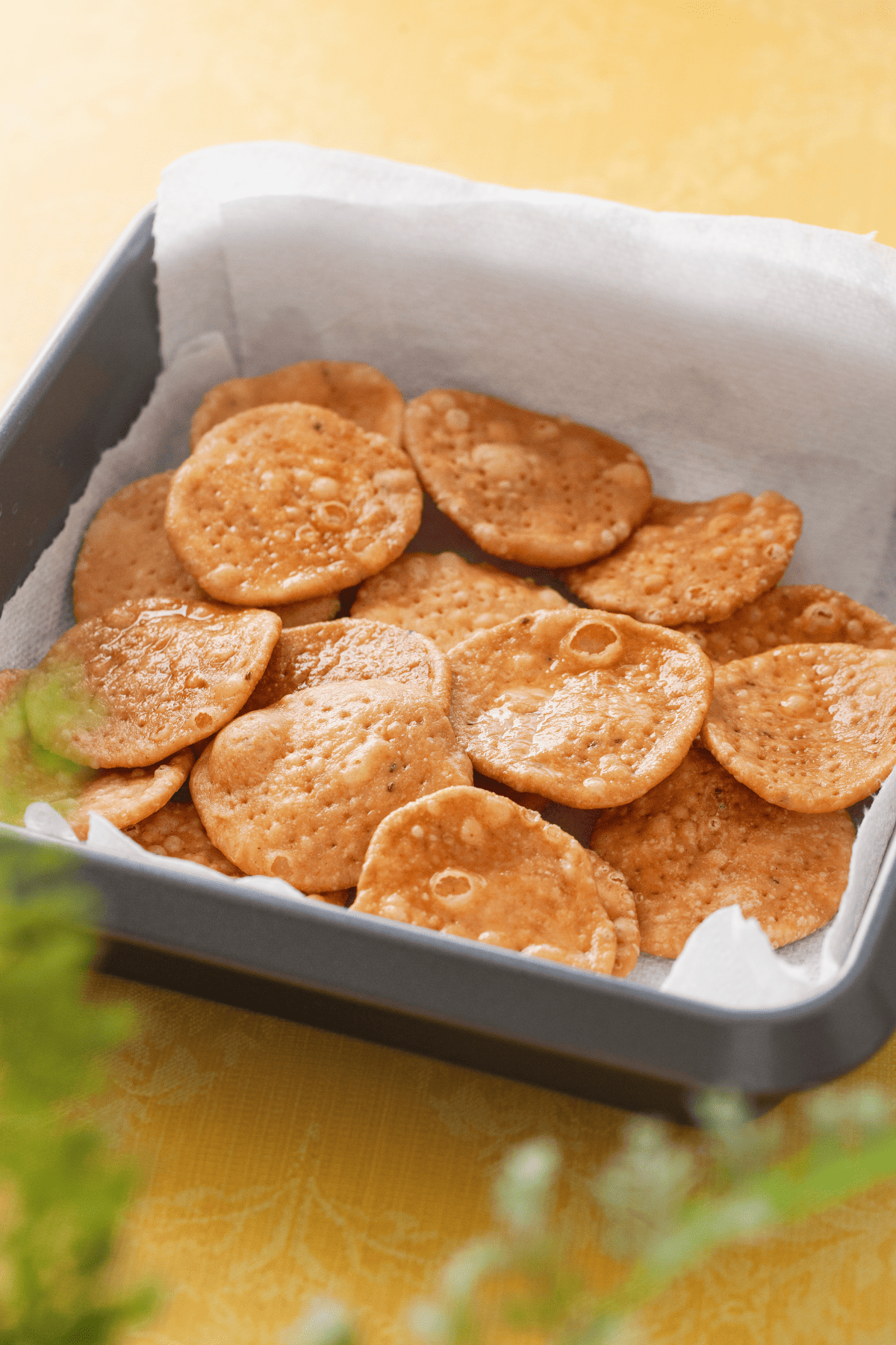 Homemade Papris in a square metal tray.
