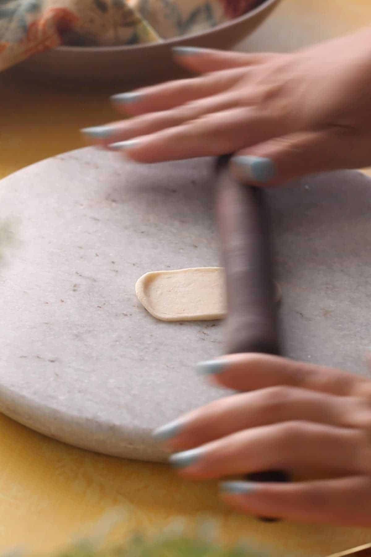 Rolling papri on a marble rolling surface.