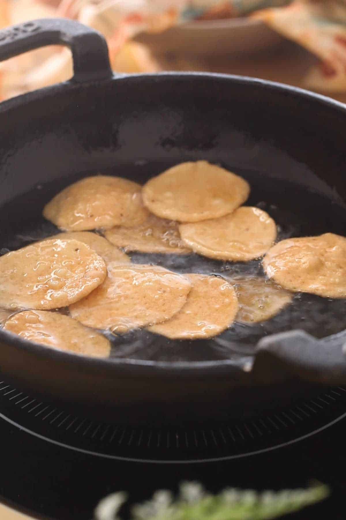 Papdi are golden brown and ready to come out of hot oil.