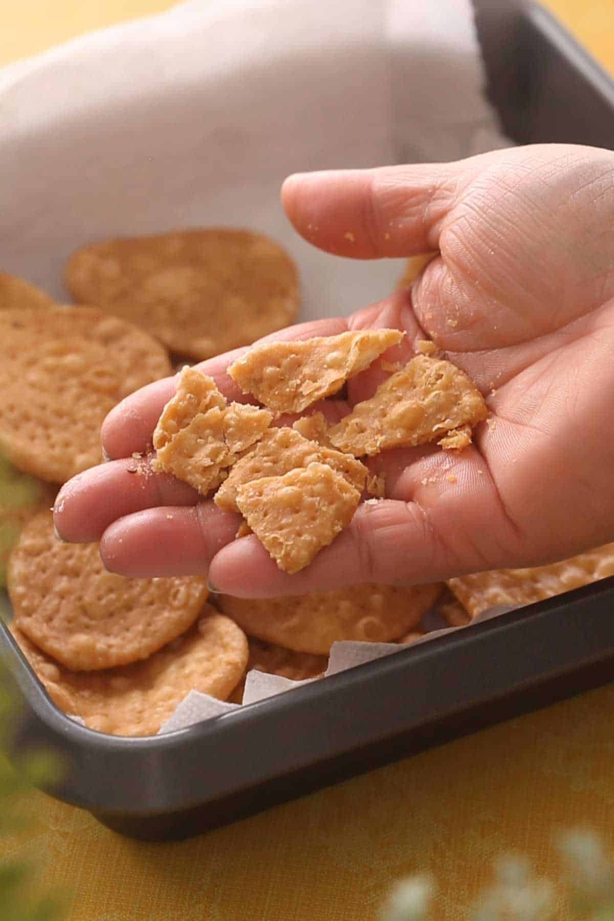 This image shows a broken papri to show how crispy and flaky it is.