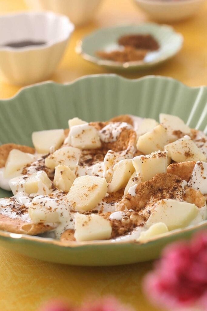 Potatoes and ground spices added to papri chaat.
