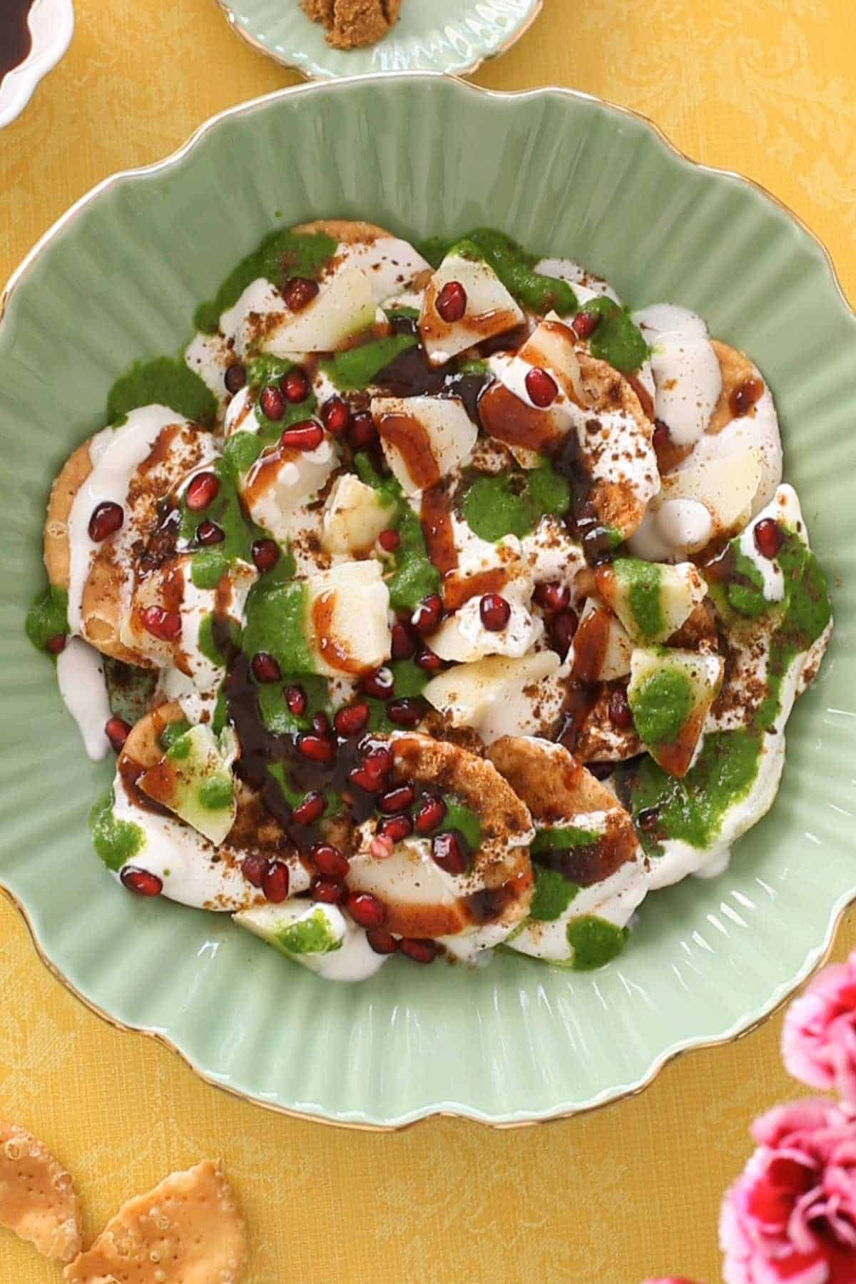 Finish papri chaat with pomegranate seeds.