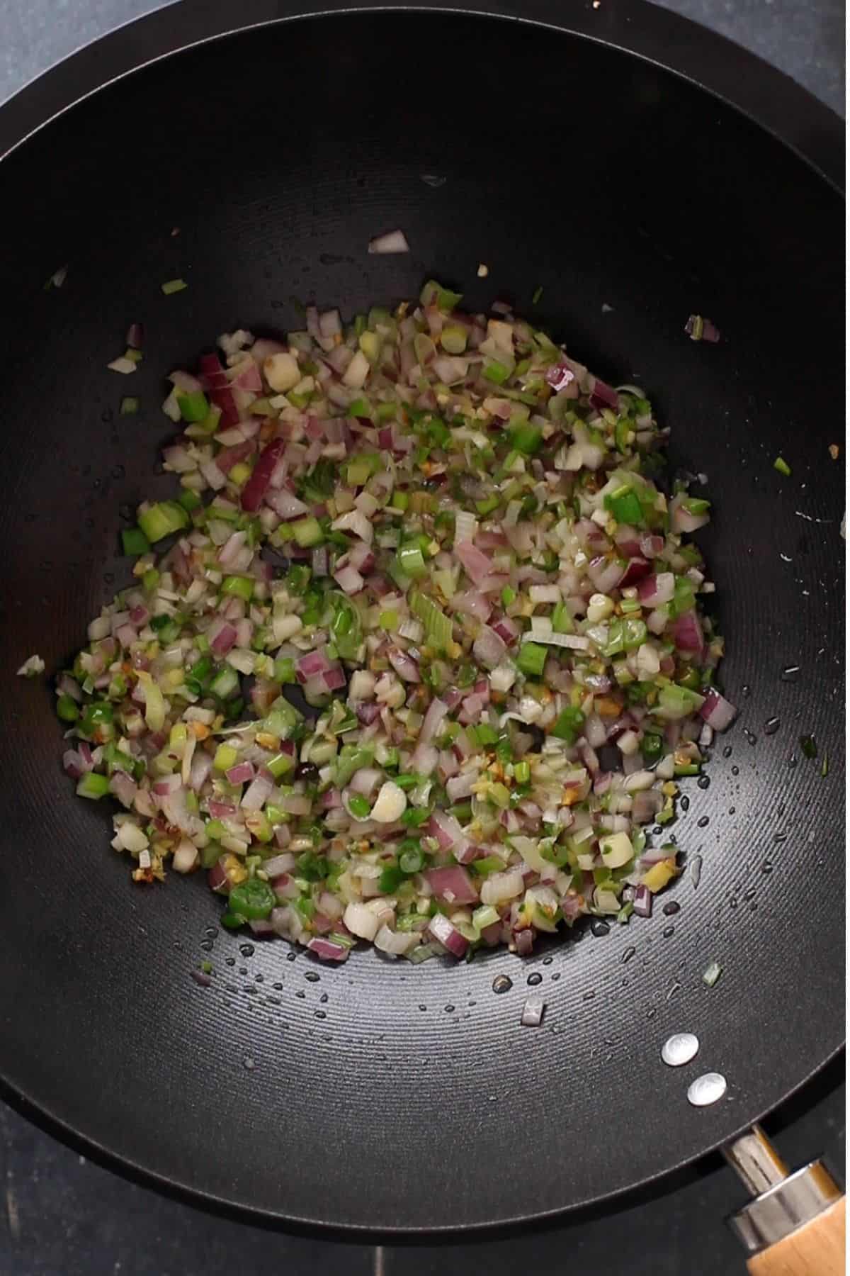 Stir fry aromatics on high heat.