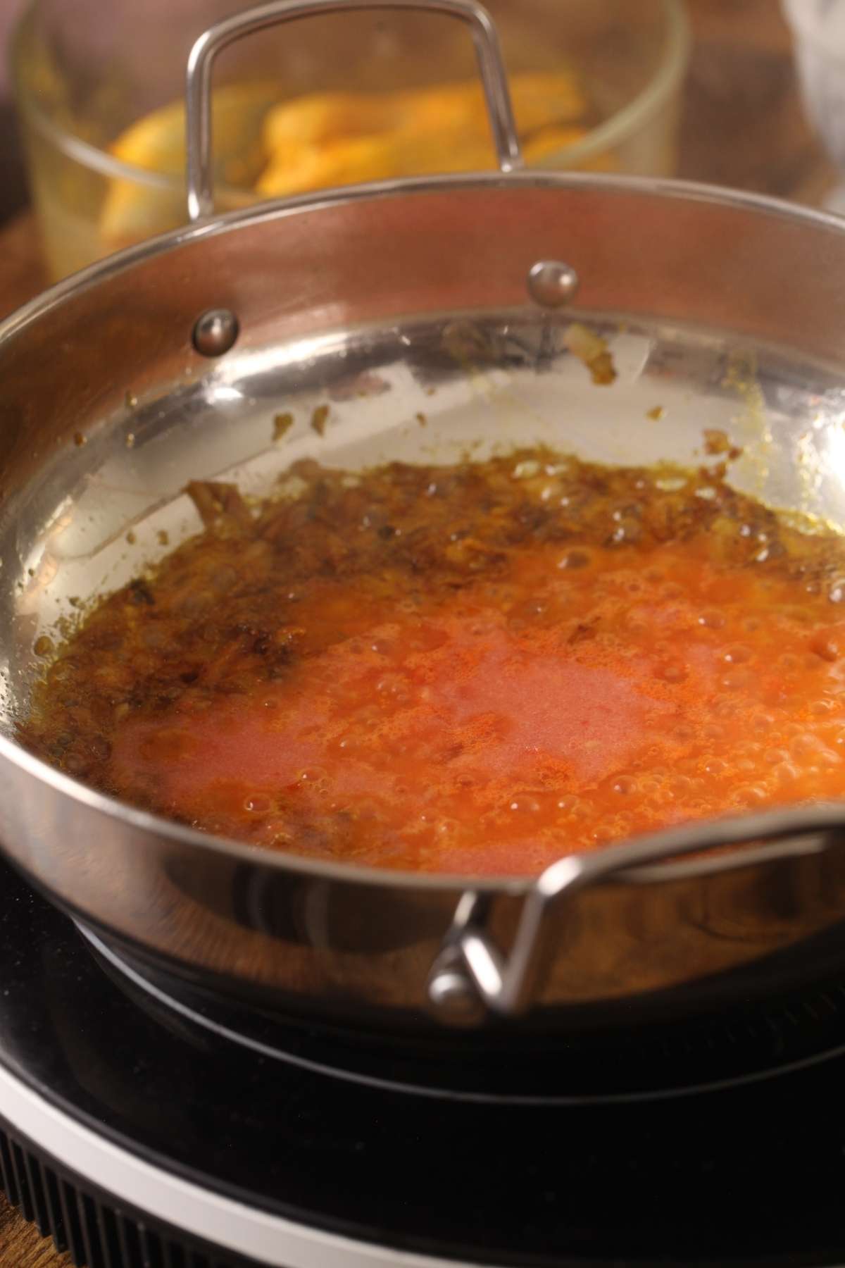 Blended Tomatoes added to make masala.