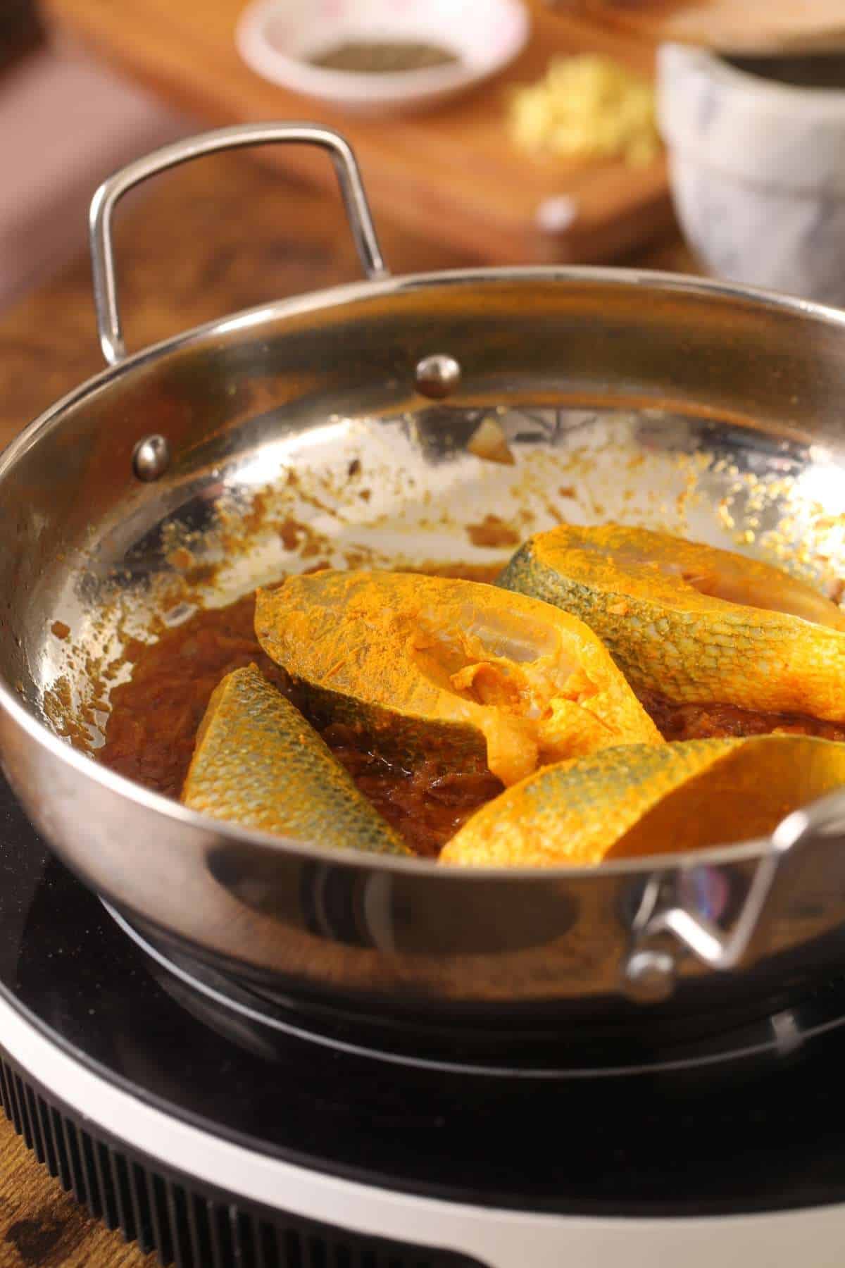 Fish layered on the masala