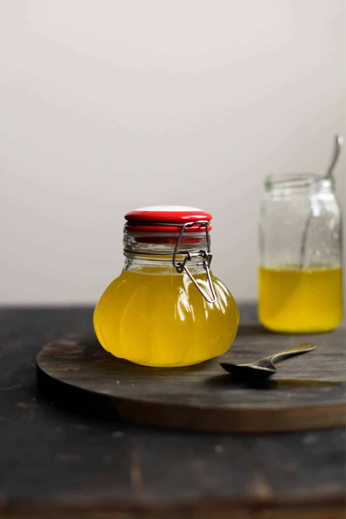 Homemade ghee in a glass jar.