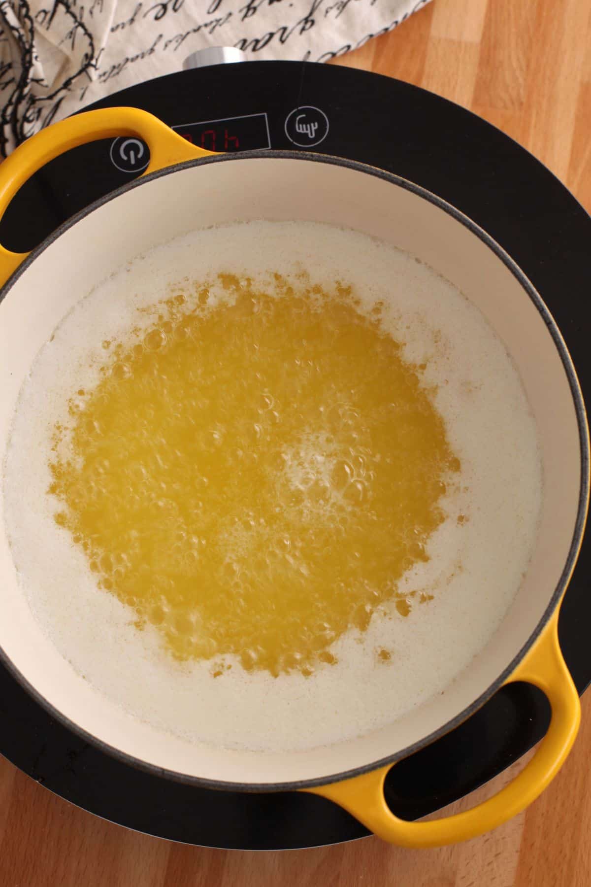 Butter bubbling in a dutch oven.