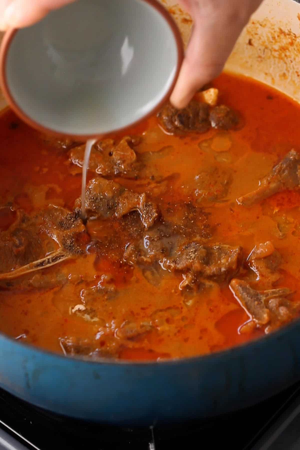 Laal Maas is finished with garam masala and ghee.