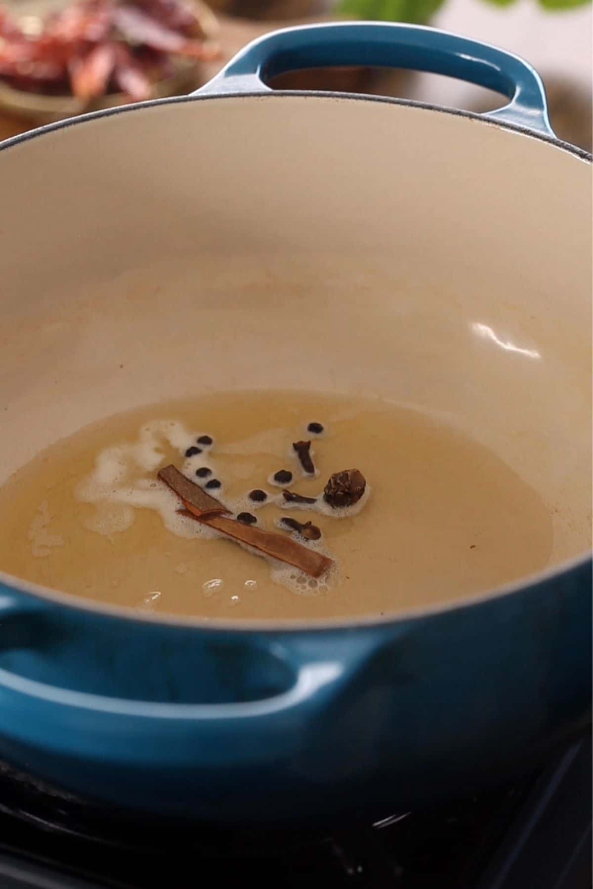 Whole spices added to warm ghee.