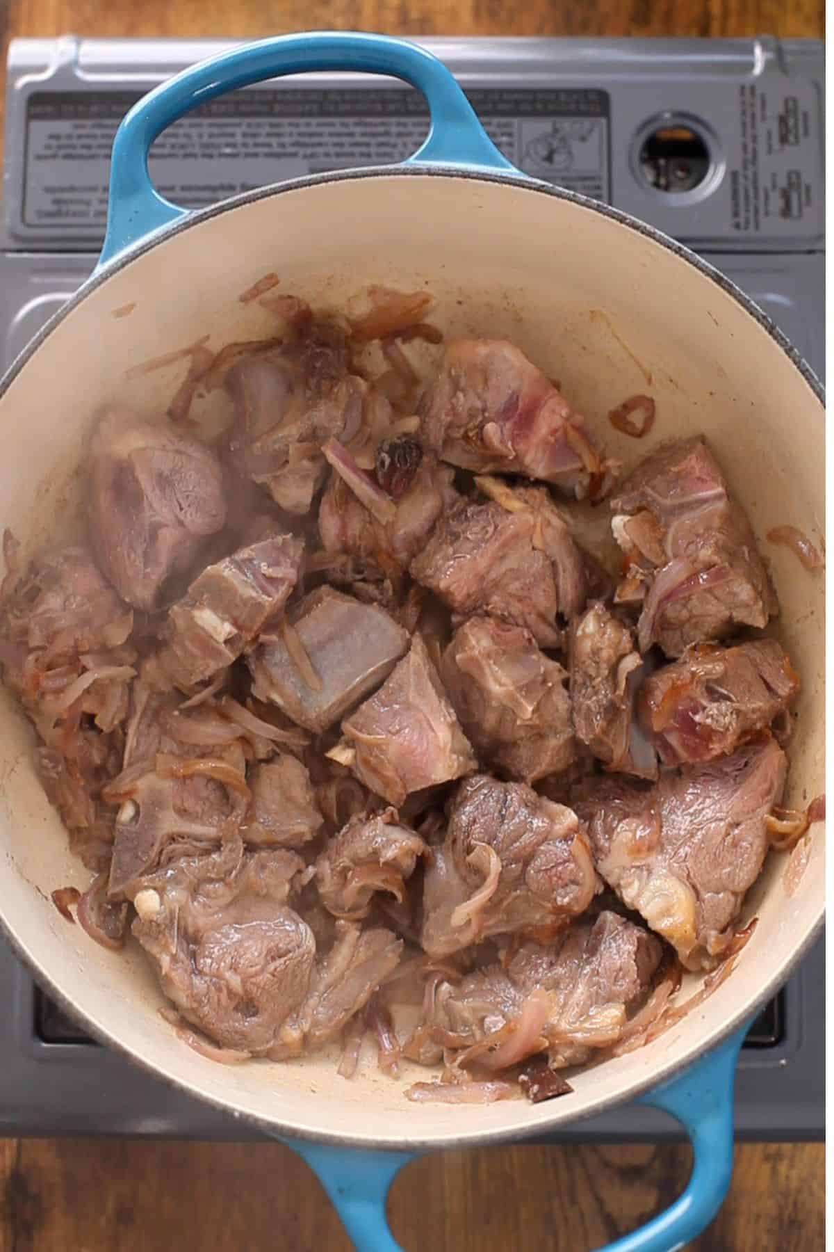Meat is browned along with onions. 