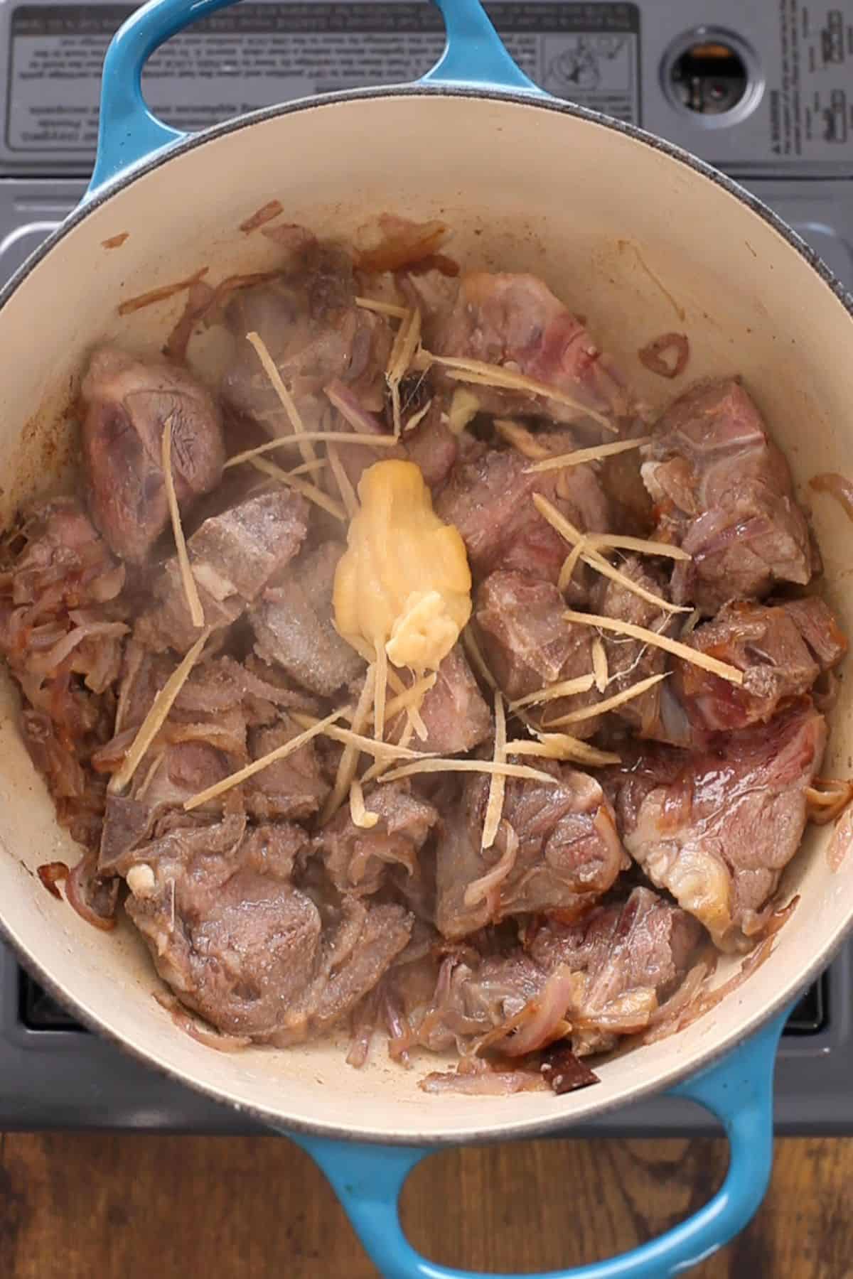 Garlic Paste and ginger is added to the goat meat.
