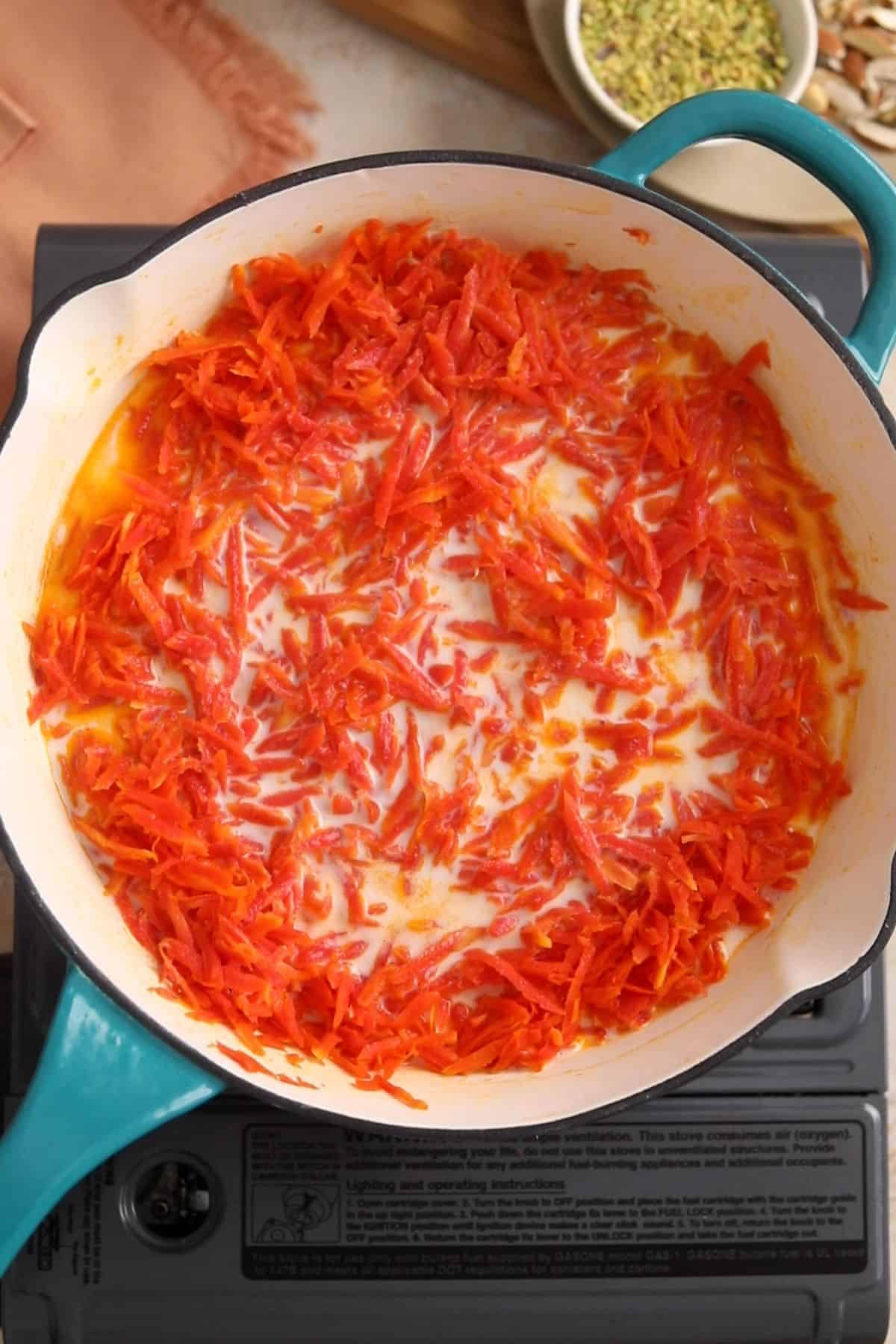 Milk is added to the carrots.