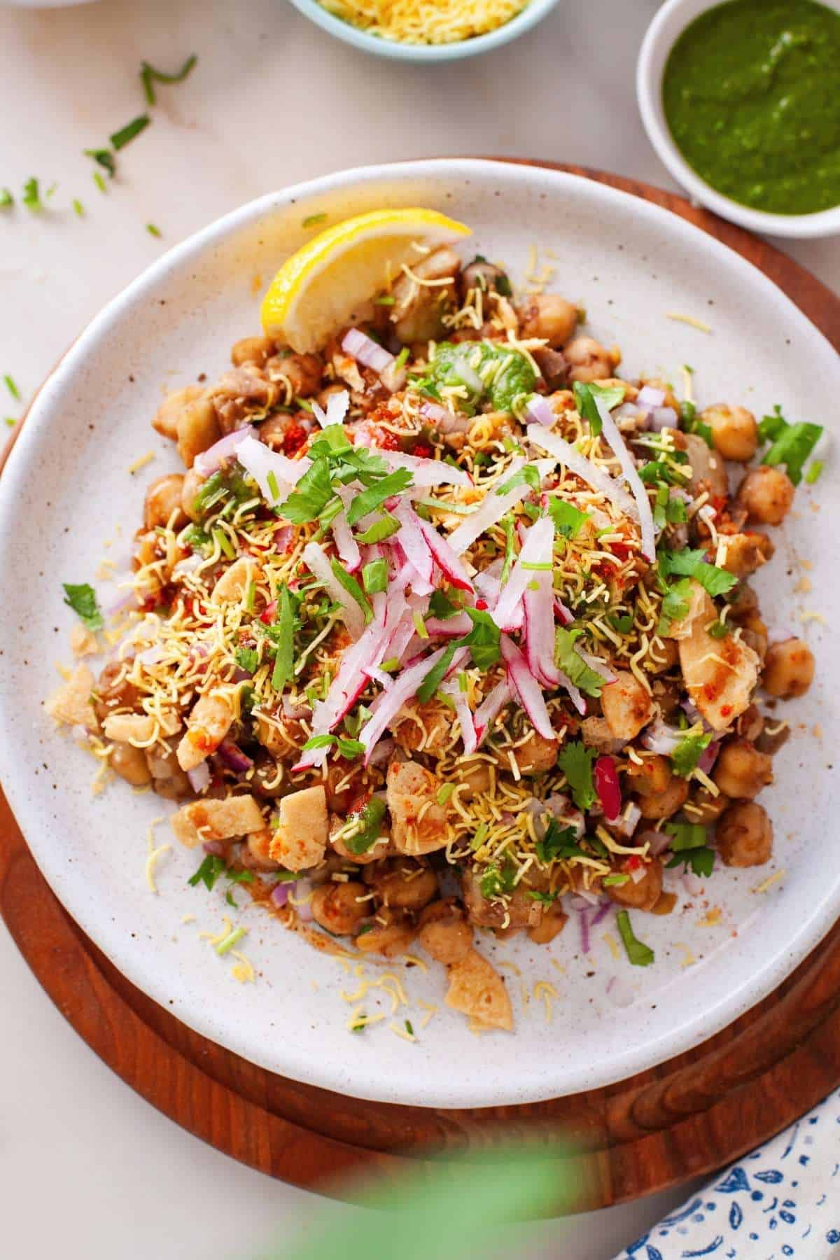 Warm chana Chaat served on a white plate. 