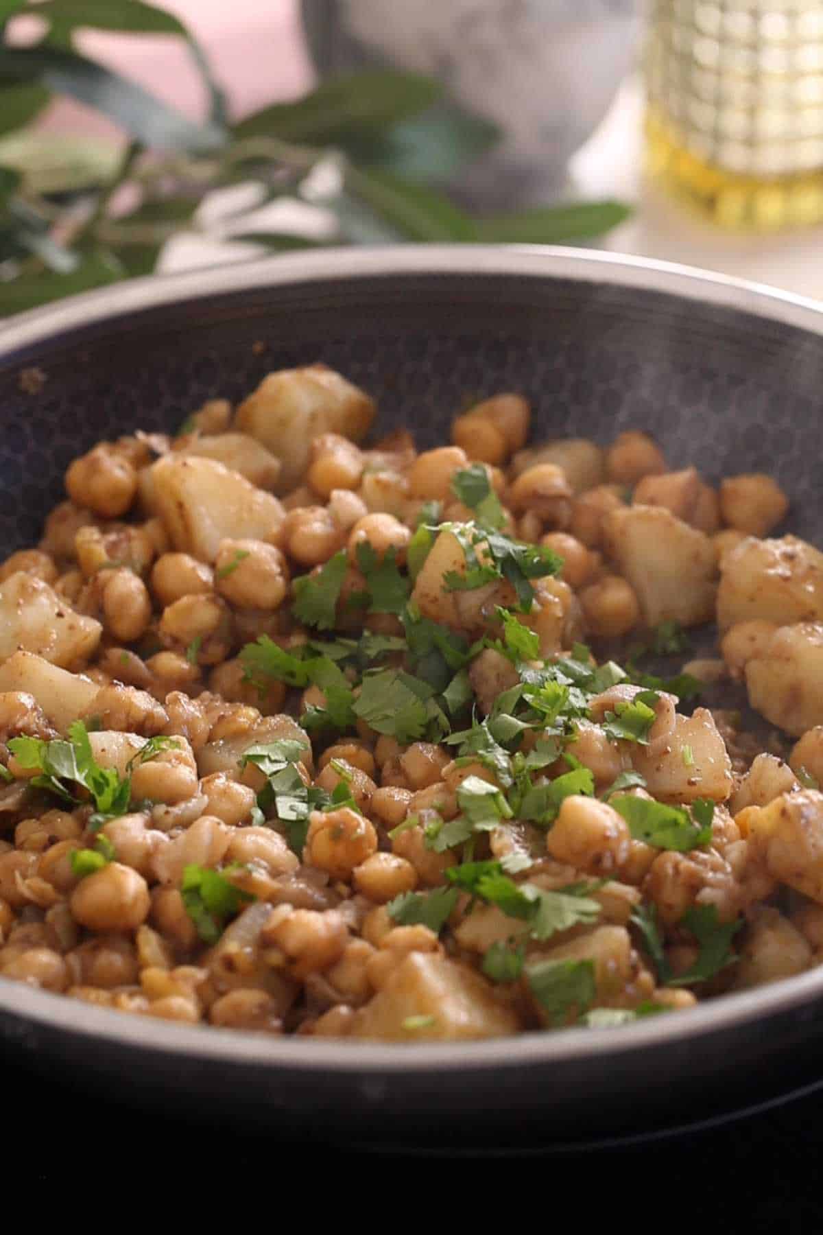 Warm chole chaat mixture sprinkled with cilantro.