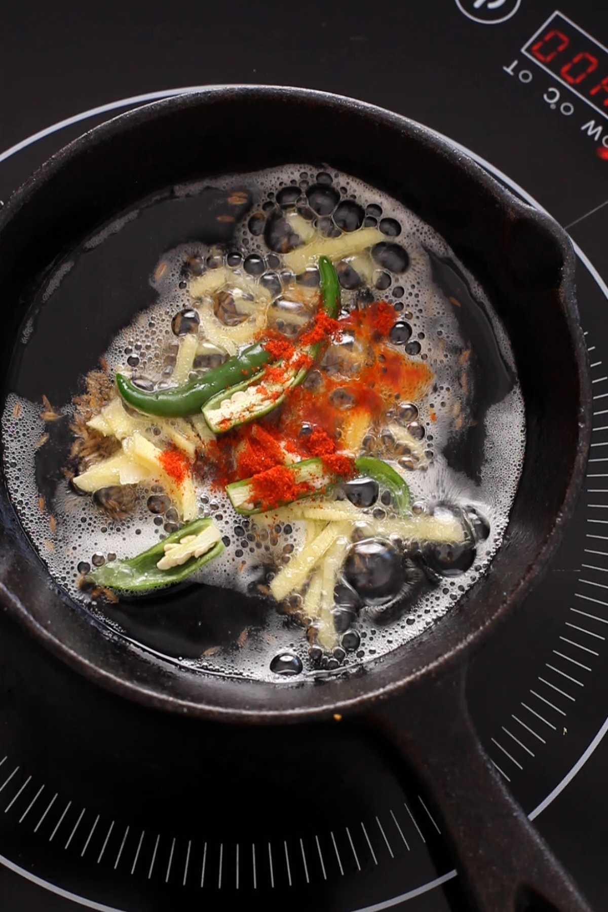 Ghee tempered with ginger and spices.