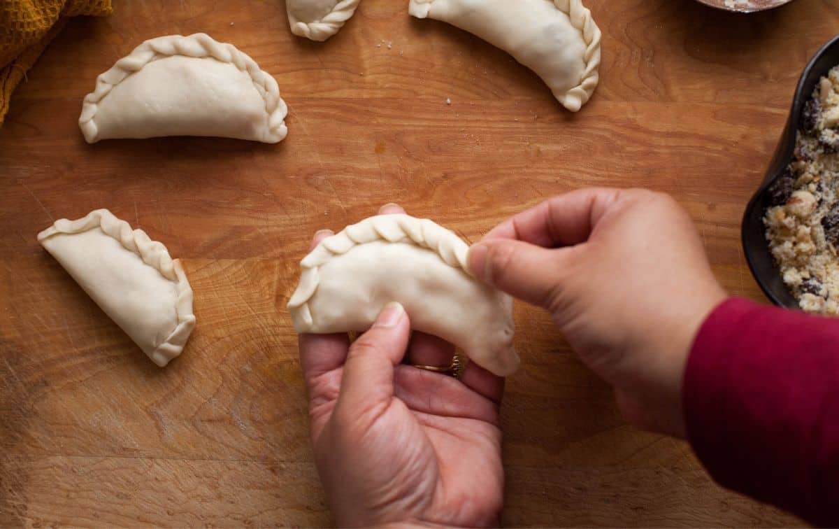 Gujiya edges are being pleated