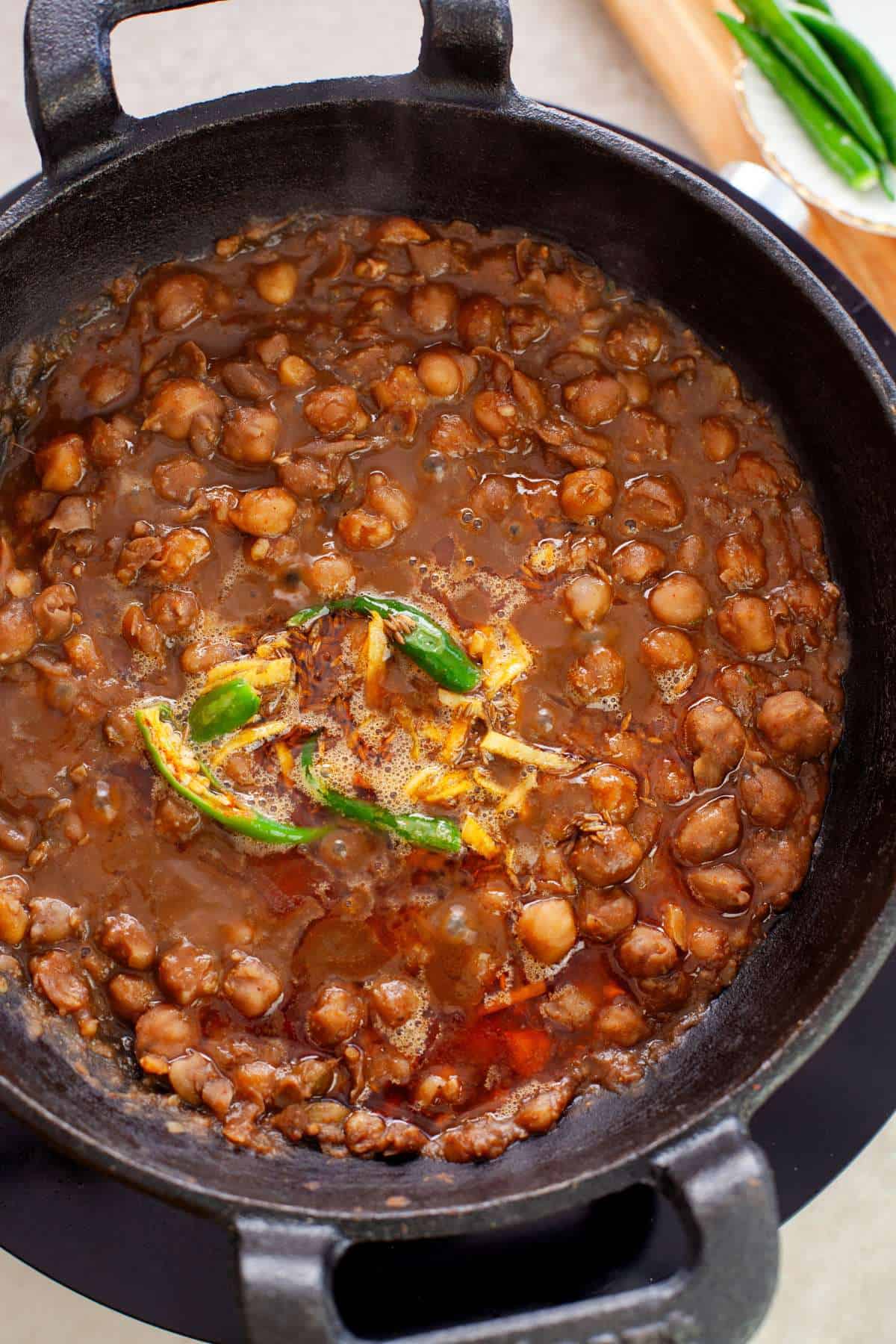 Pindi Chana Masala in a cast iron cooking pot.