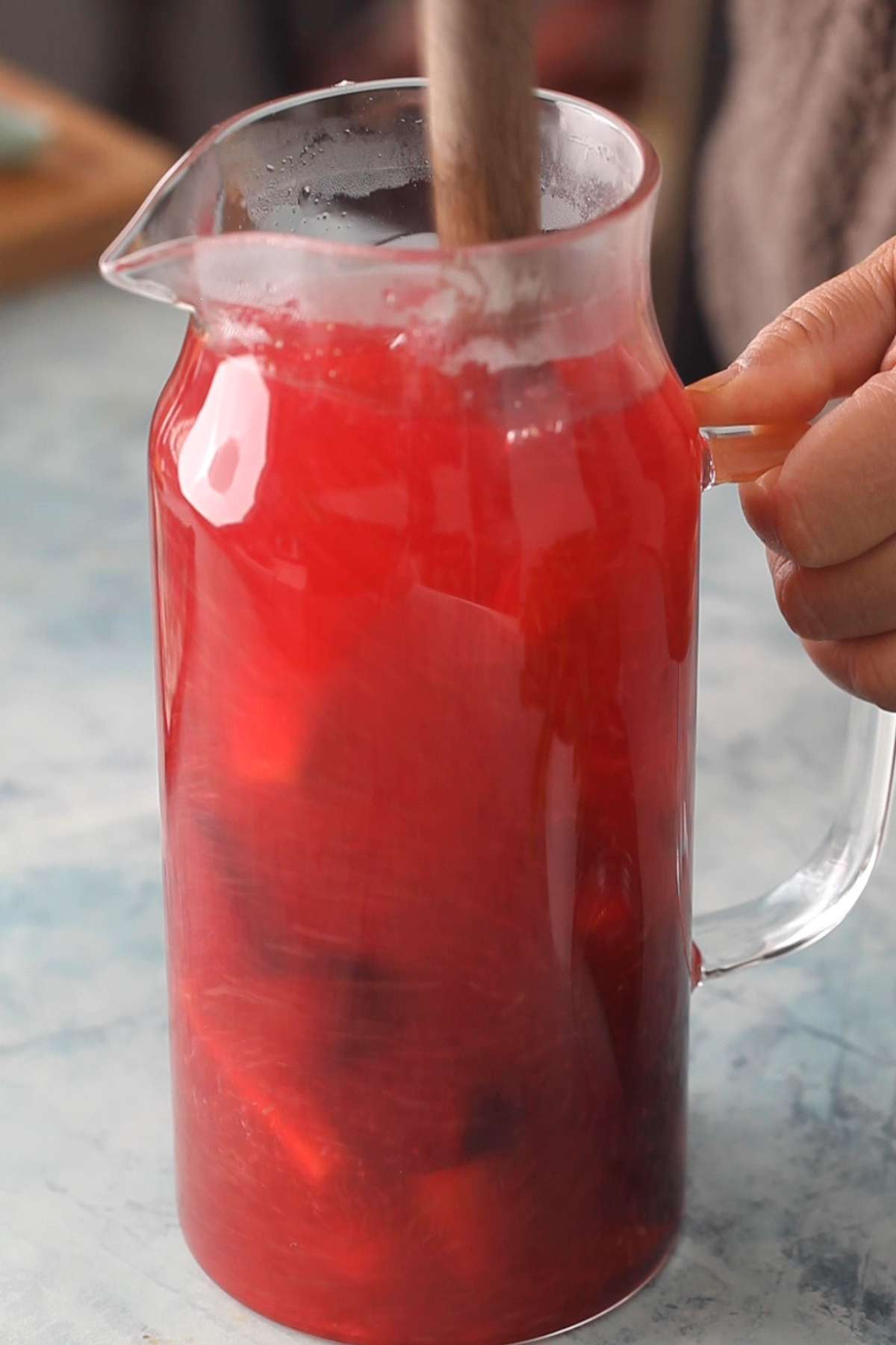 Mixing kanji with a wooden spoon.