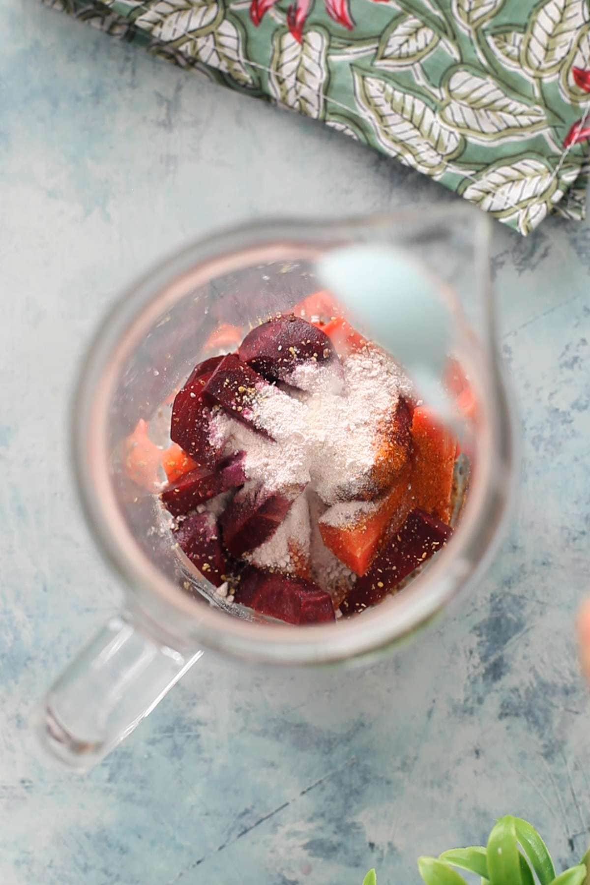 Spices and salt is added to carrots.