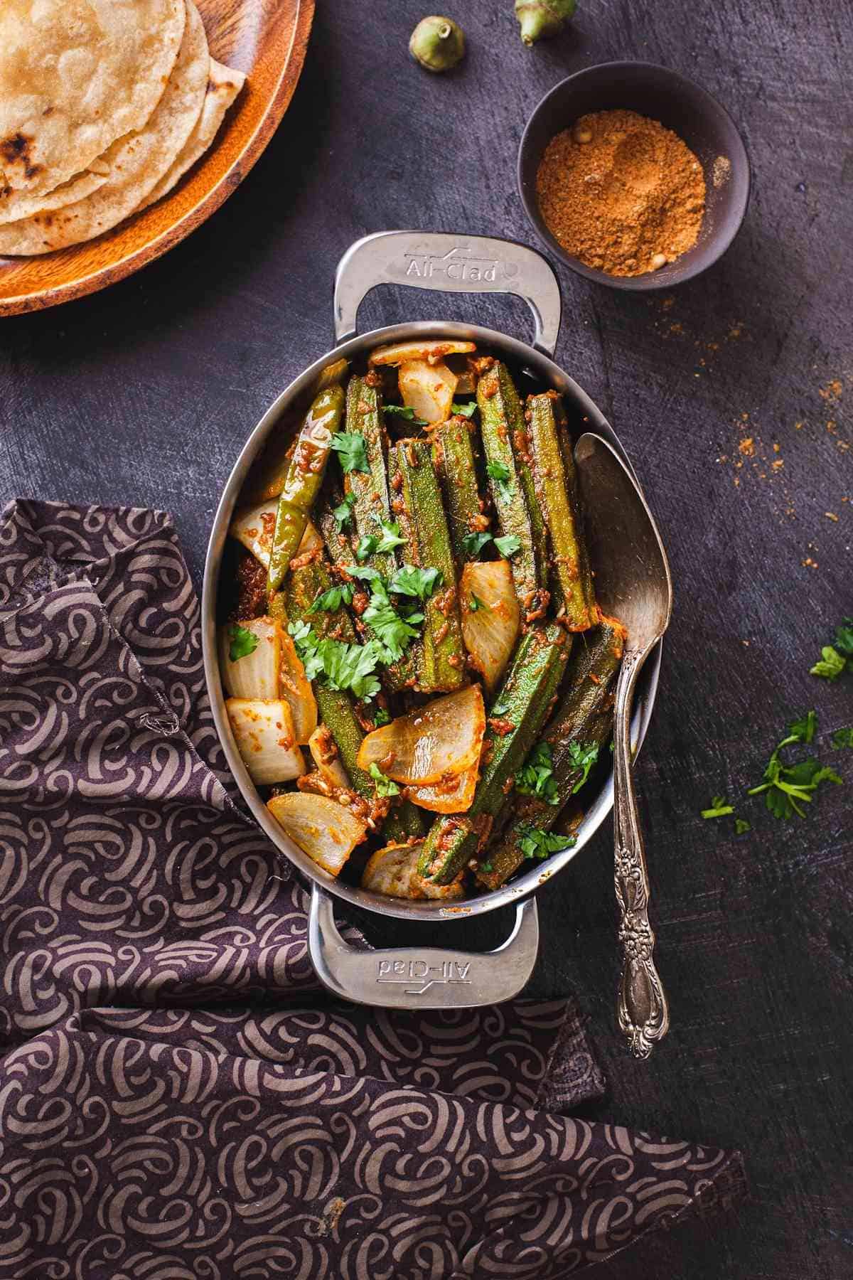 Top View of punjabi style stuffed okra served with rotis.