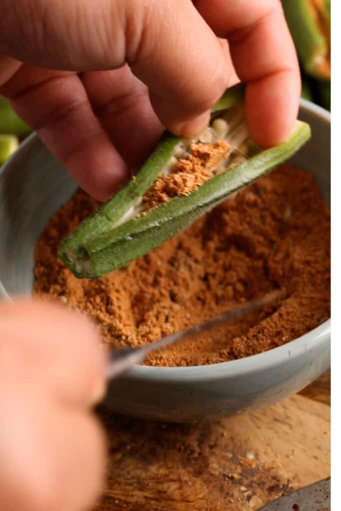 Stuff the spice powder in the okra