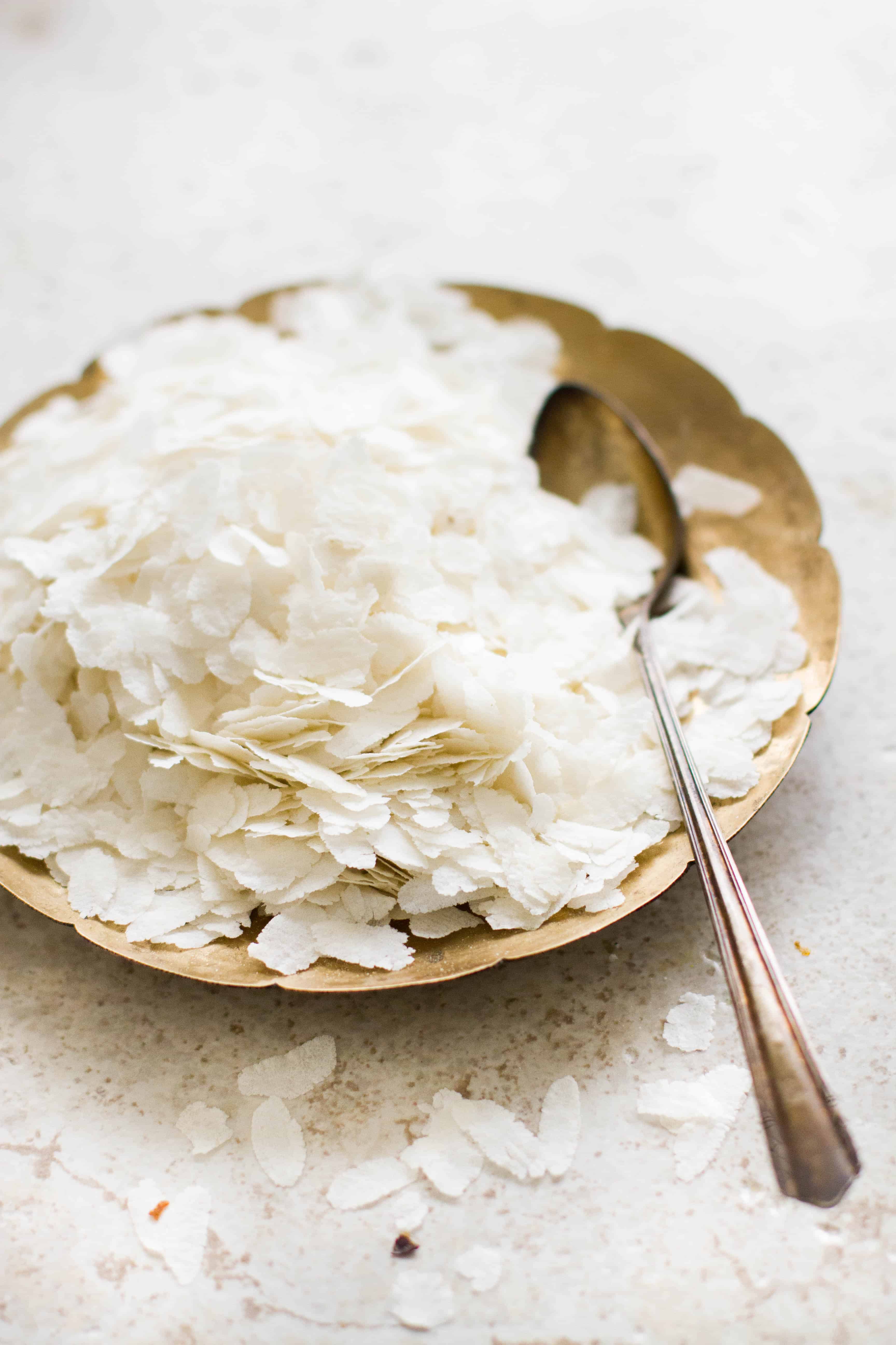 Flattened rice flakes in a brass plate. 