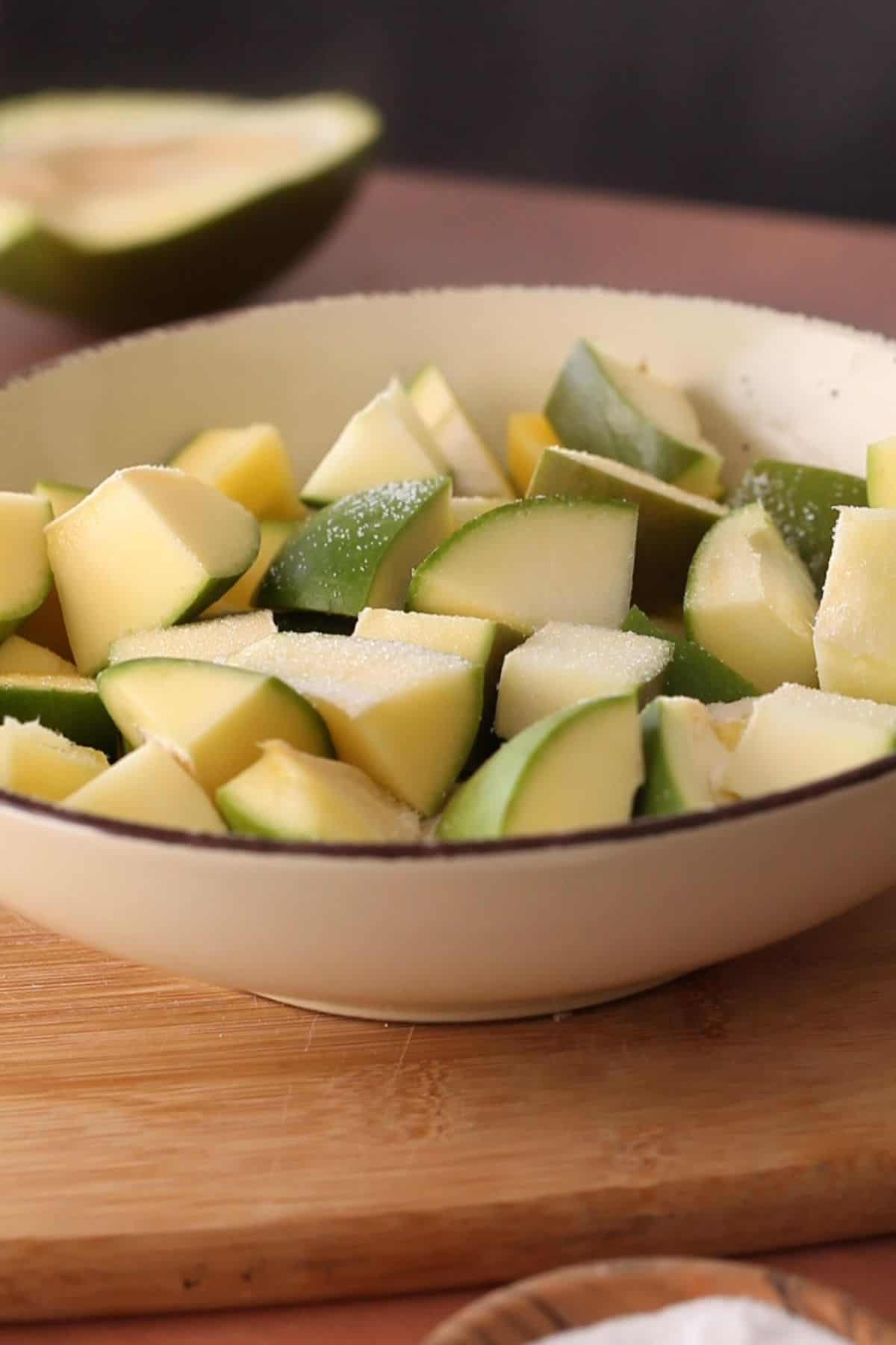 Chopped mango pieces sprinkled with salt.