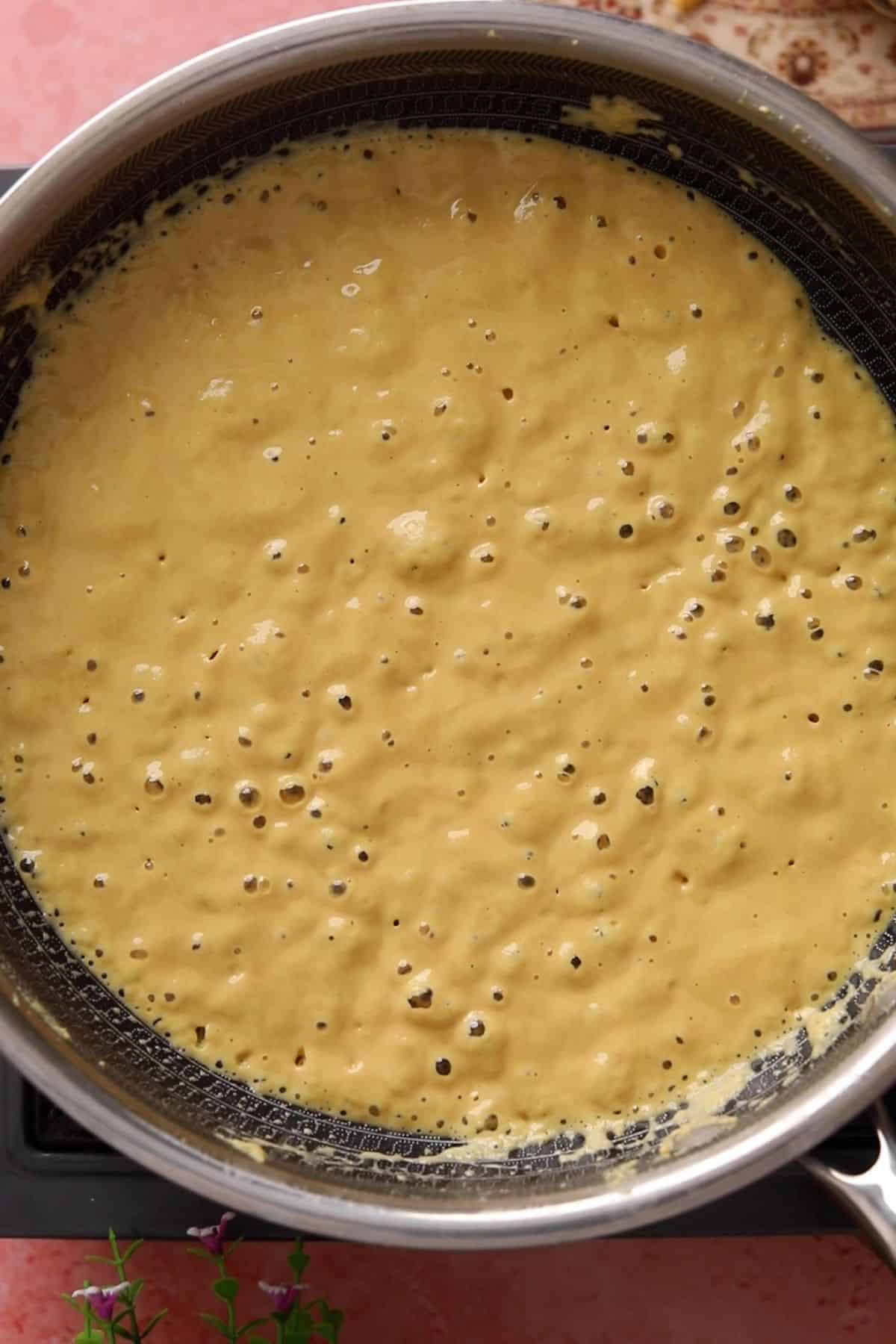 Besan mixture gets bubbly and resembles a batter. 