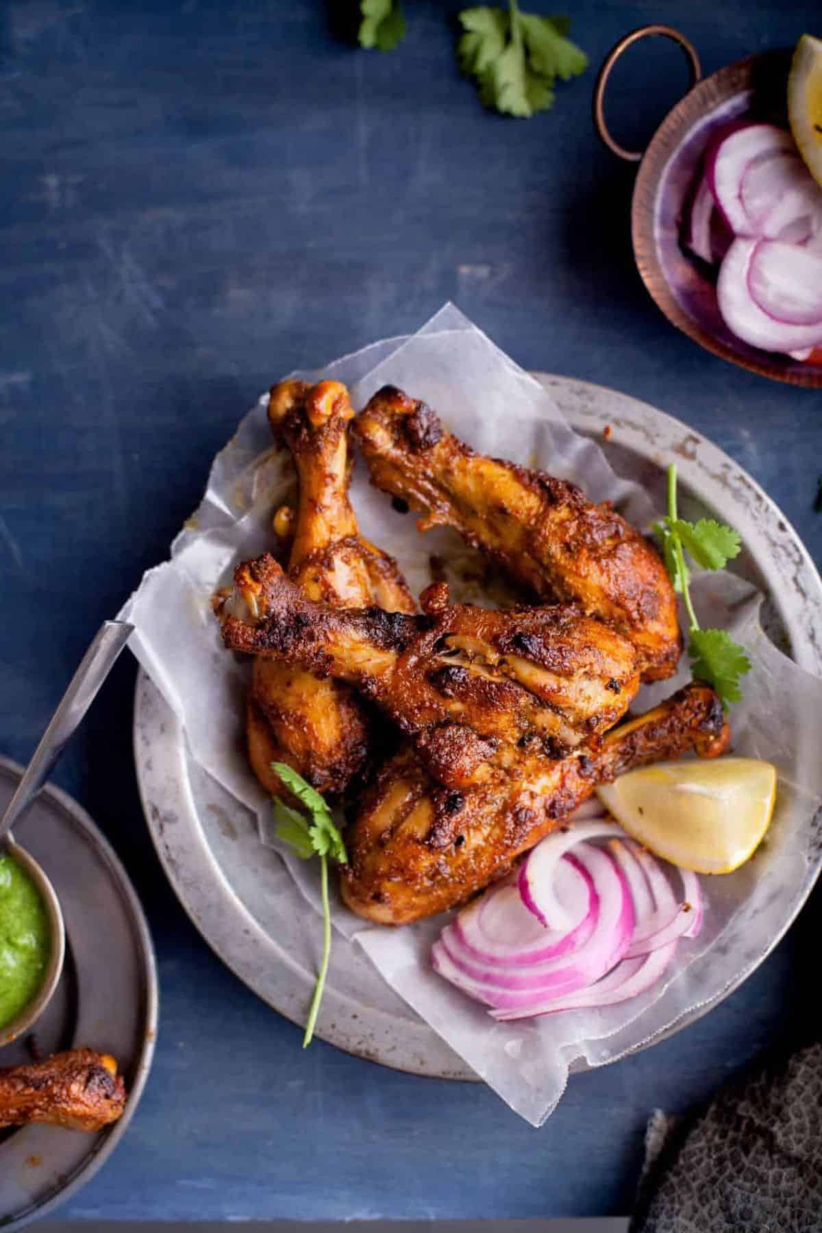 Tandoori chicken drumsticks made in a food color free marinade.