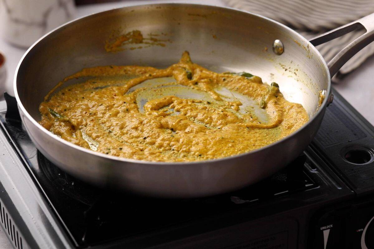 Yogurt is cooked with mustard until oil seperates.