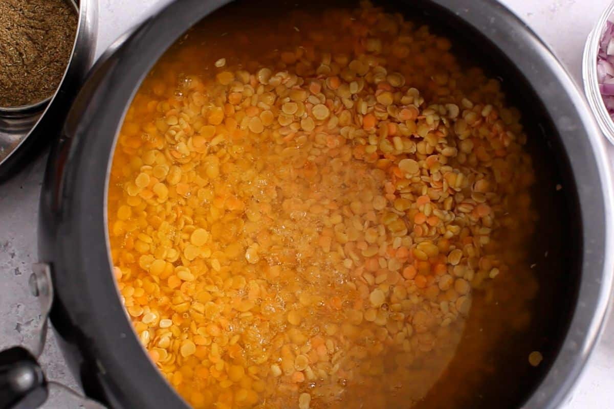 Lentil mixture in pressure cooker. 