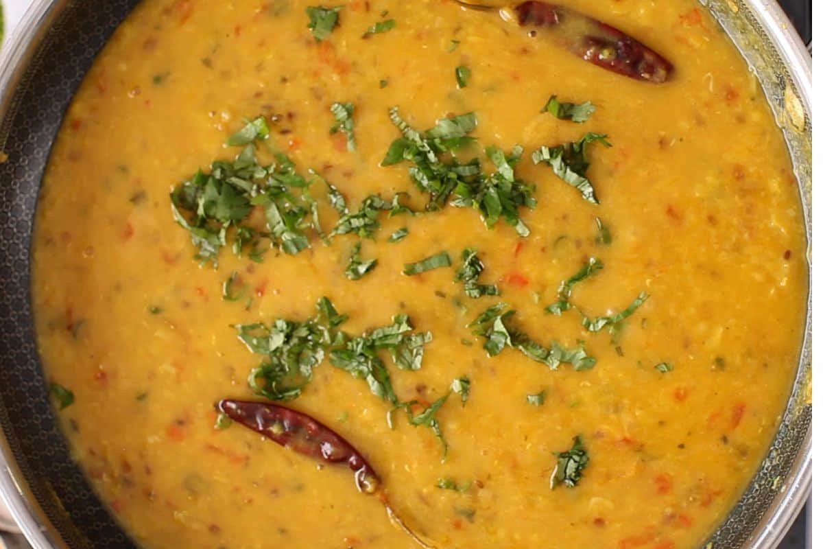 Dal tadka is topped with cilantro.