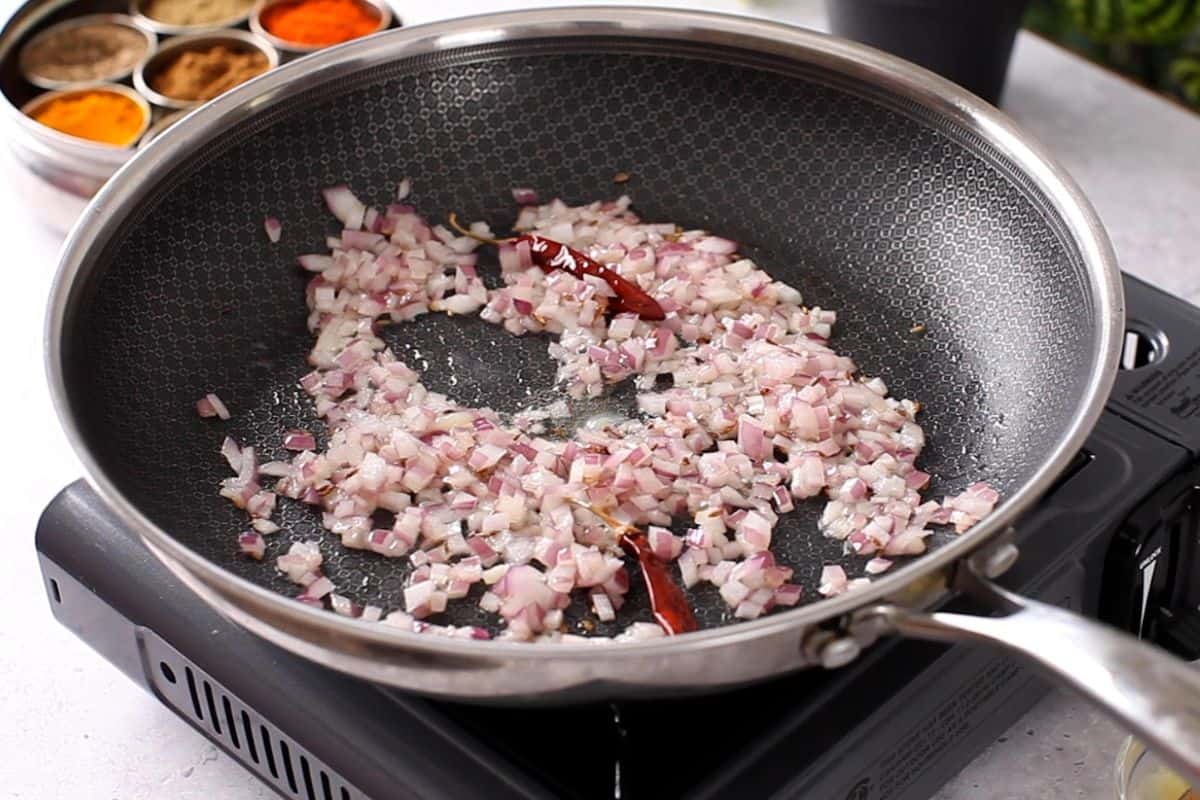 Onions and dry chili are fried in ghee.