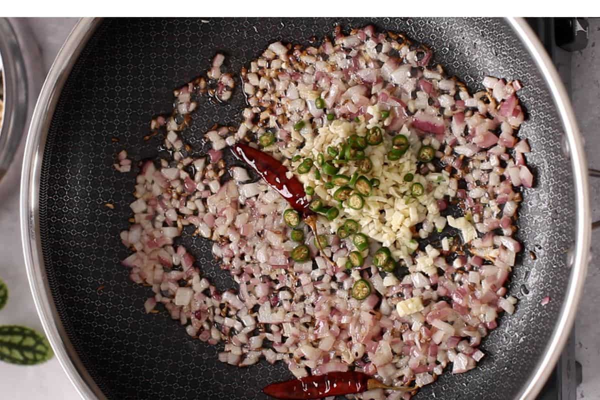 Aromatics are added to fried onions.