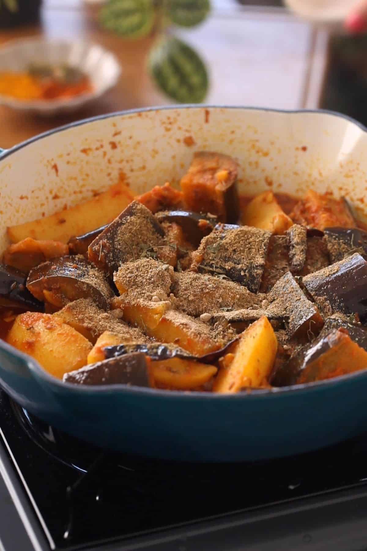 Aloo baingan finished with spices and kasuri methi.