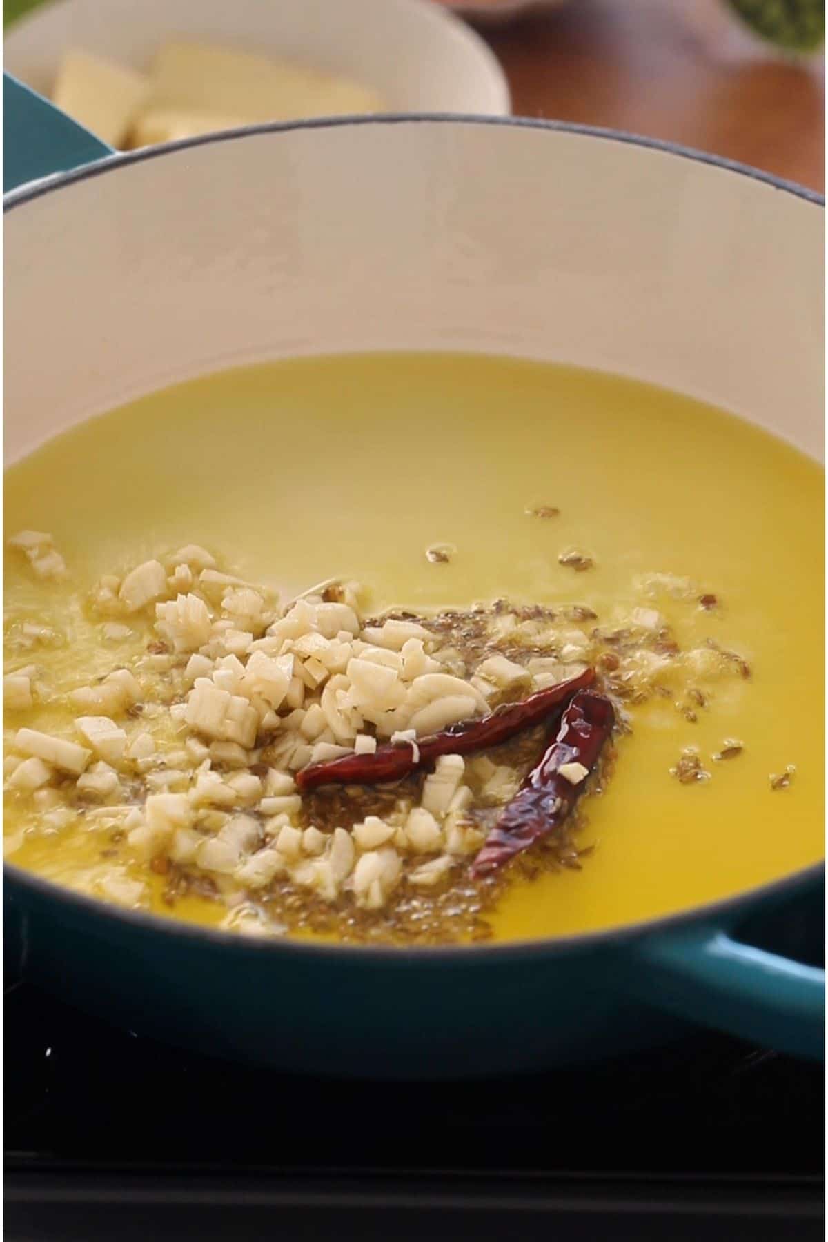 Mustard Oil tempered with chopped garlic and whole spices.