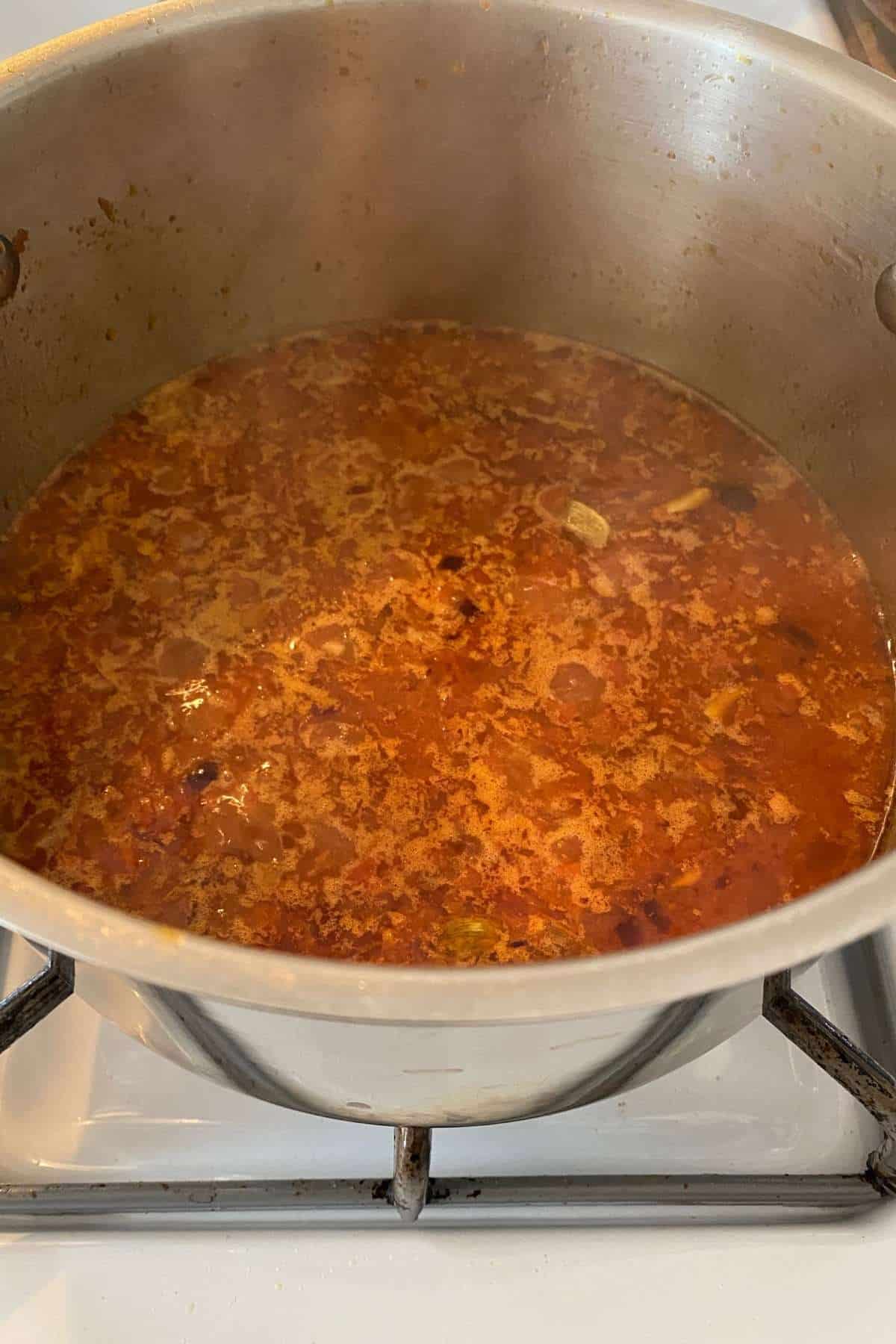 Add water to thin out the masala.