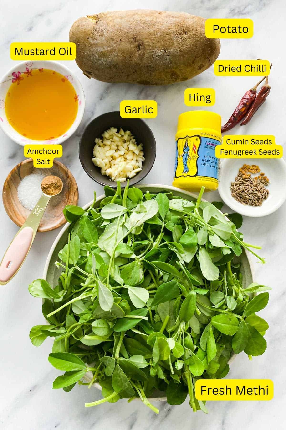 Ingredients needed to make methi aloo sabzi.