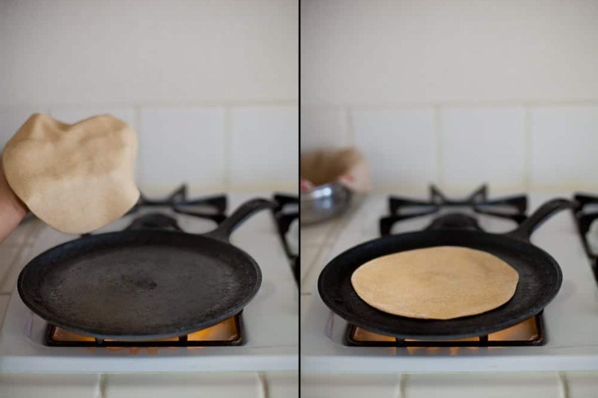 Roti is being place on a hot tawa.