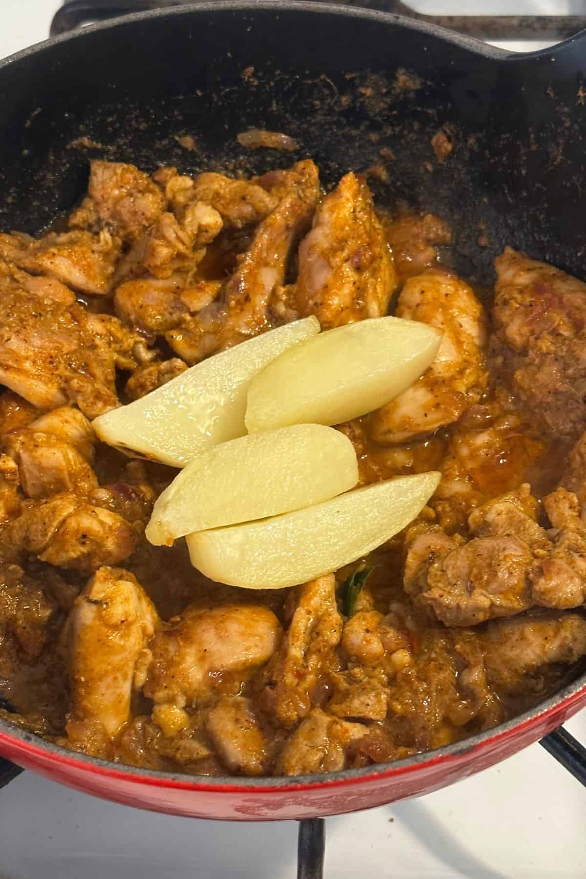 Shallow fried potatoe sis added to chicken.