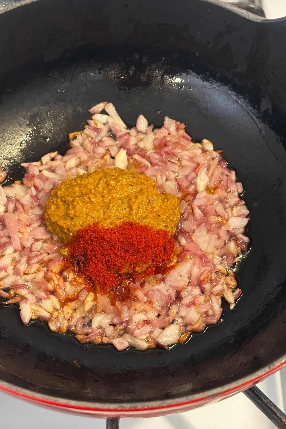 Vindaloo paste and kashmiri red chili powder added to onion.